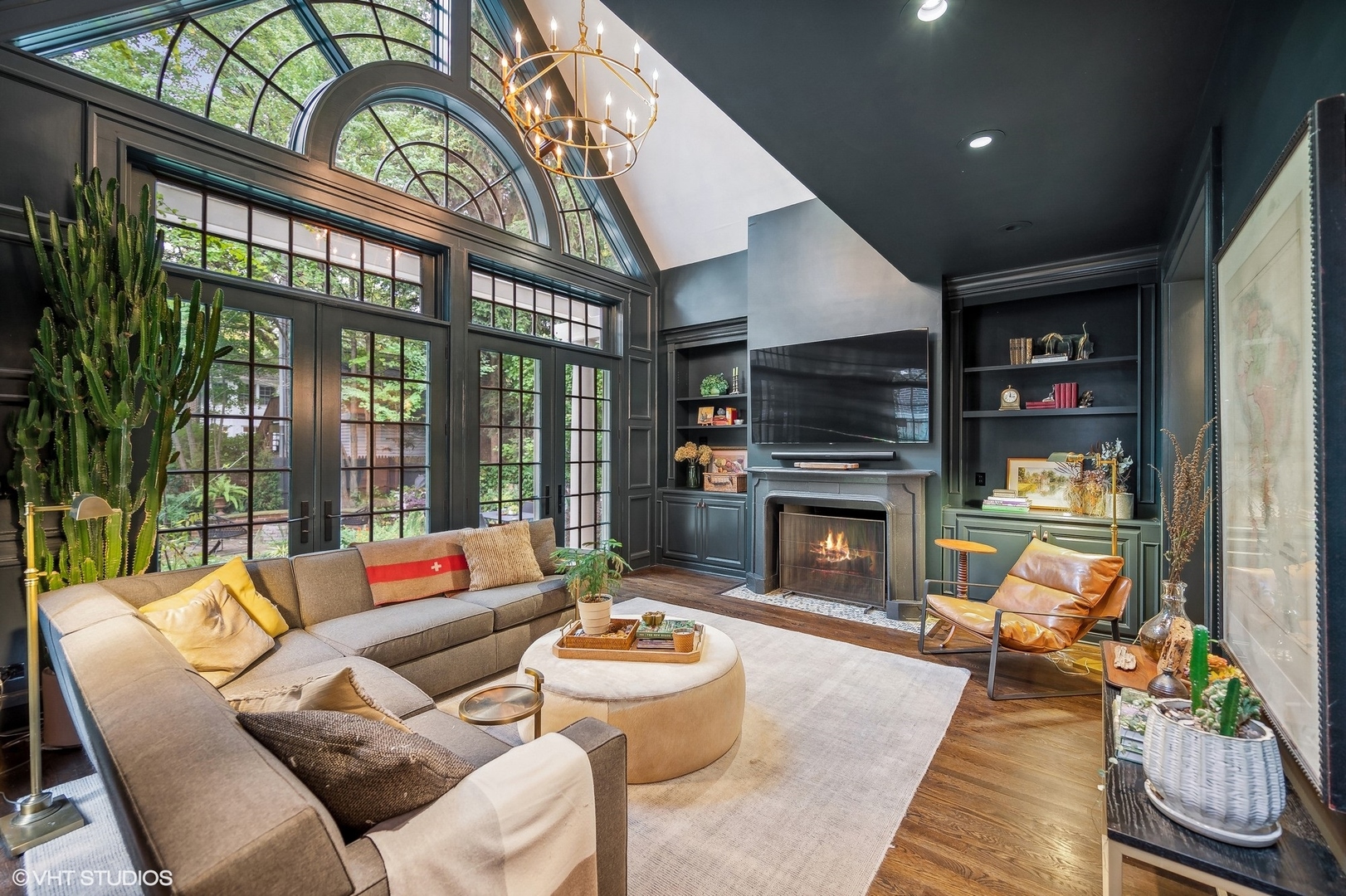 354 Elder Lane Winnetka, IL 60093 - Photo 42 of 71 a living room with furniture a fireplace and a flat screen tv