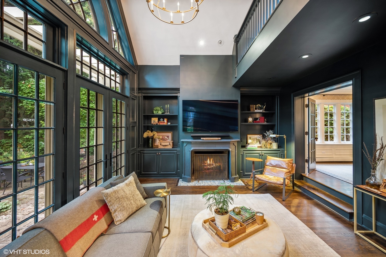 354 Elder Lane Winnetka, IL 60093 - Photo 43 of 71 a living room with furniture a flat screen tv and a fireplace