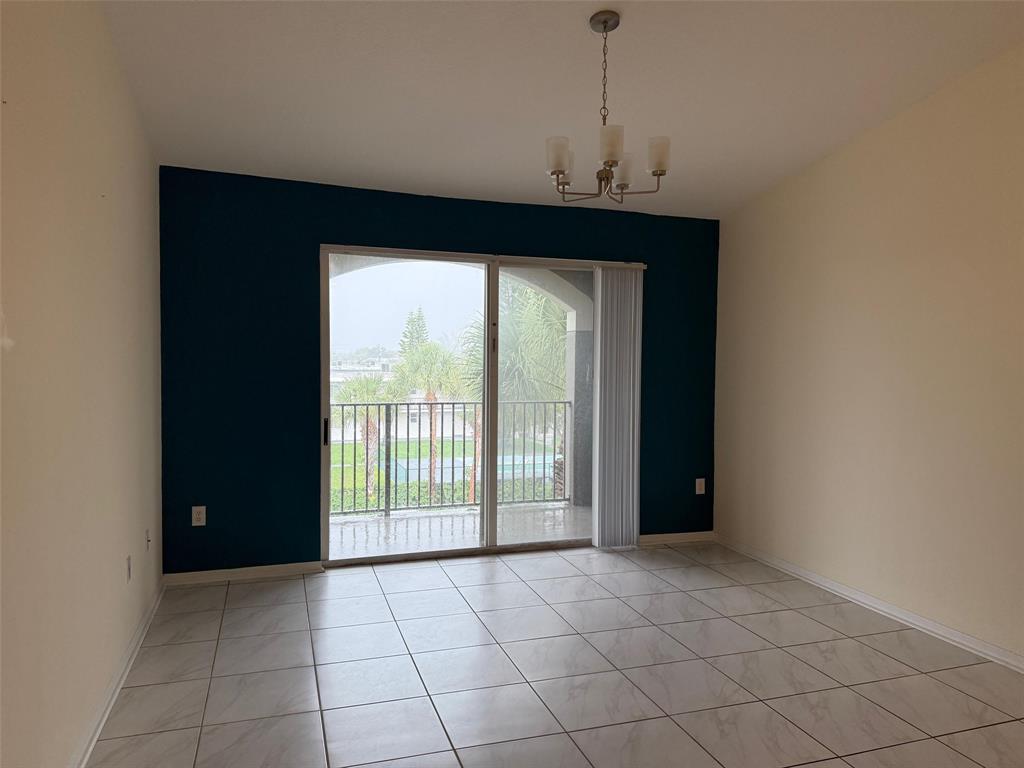6831 Southwest 44th Street, Unit 312 Miami, FL 33155 - Photo 11 of 34 a view of an empty room with a window