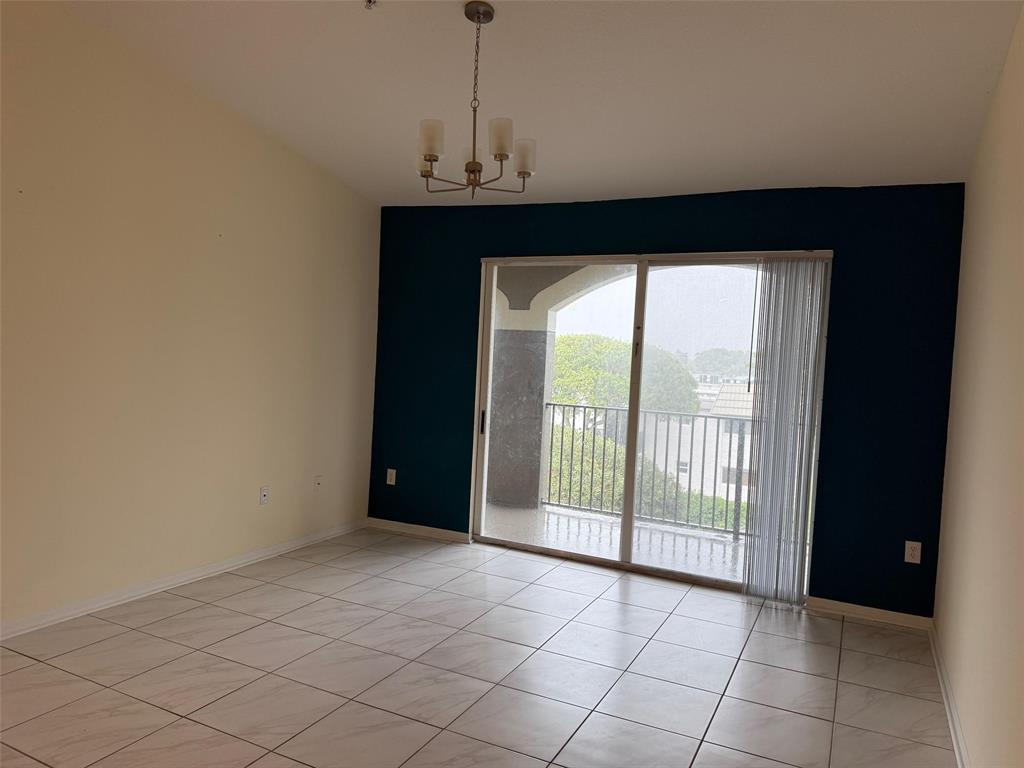 6831 Southwest 44th Street, Unit 312 Miami, FL 33155 - Photo 12 of 34 a view of an empty room with a window