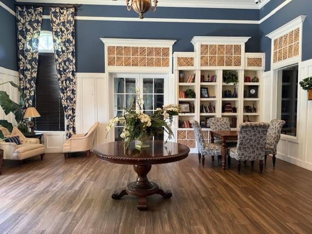 6831 Southwest 44th Street, Unit 312 Miami, FL 33155 - Photo 22 of 34 a view of a dining room with furniture and wooden floor
