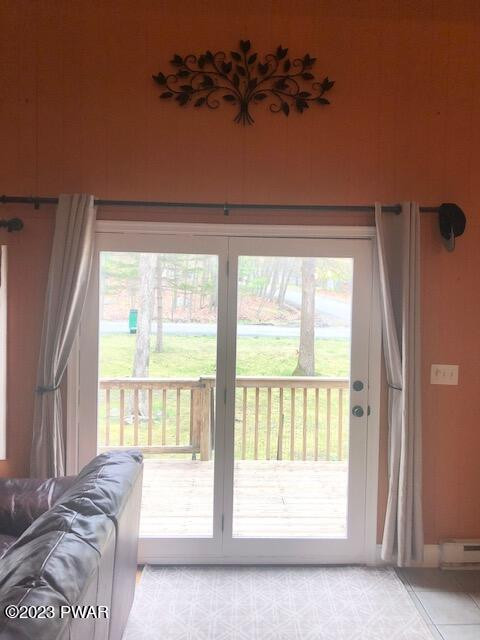 165 Butternut Road Milford, PA 18337 - Photo 21 of 27 a living room with a bed furniture and a large window