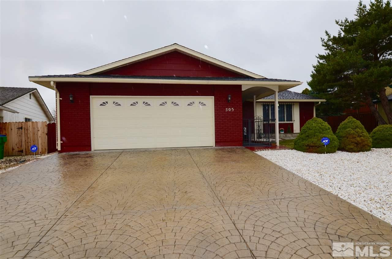 505 Cyma Circle Reno, NV 89503 - Photo 1 of 1 a front view of a house with a yard and garage