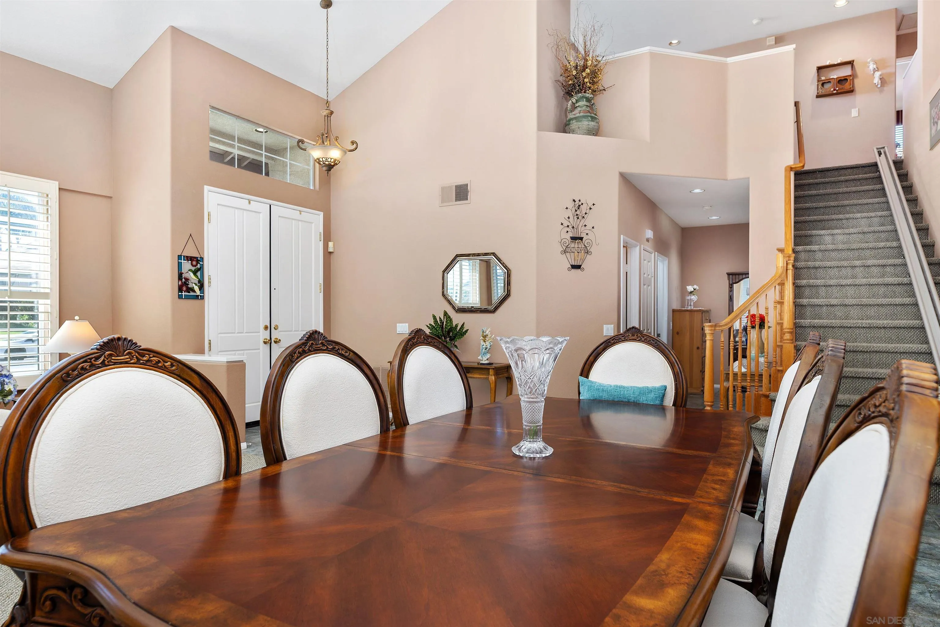5213 Palmera Drive Oceanside, CA 92056 - Photo 12 of 38 a view of a dining room with furniture and chandelier