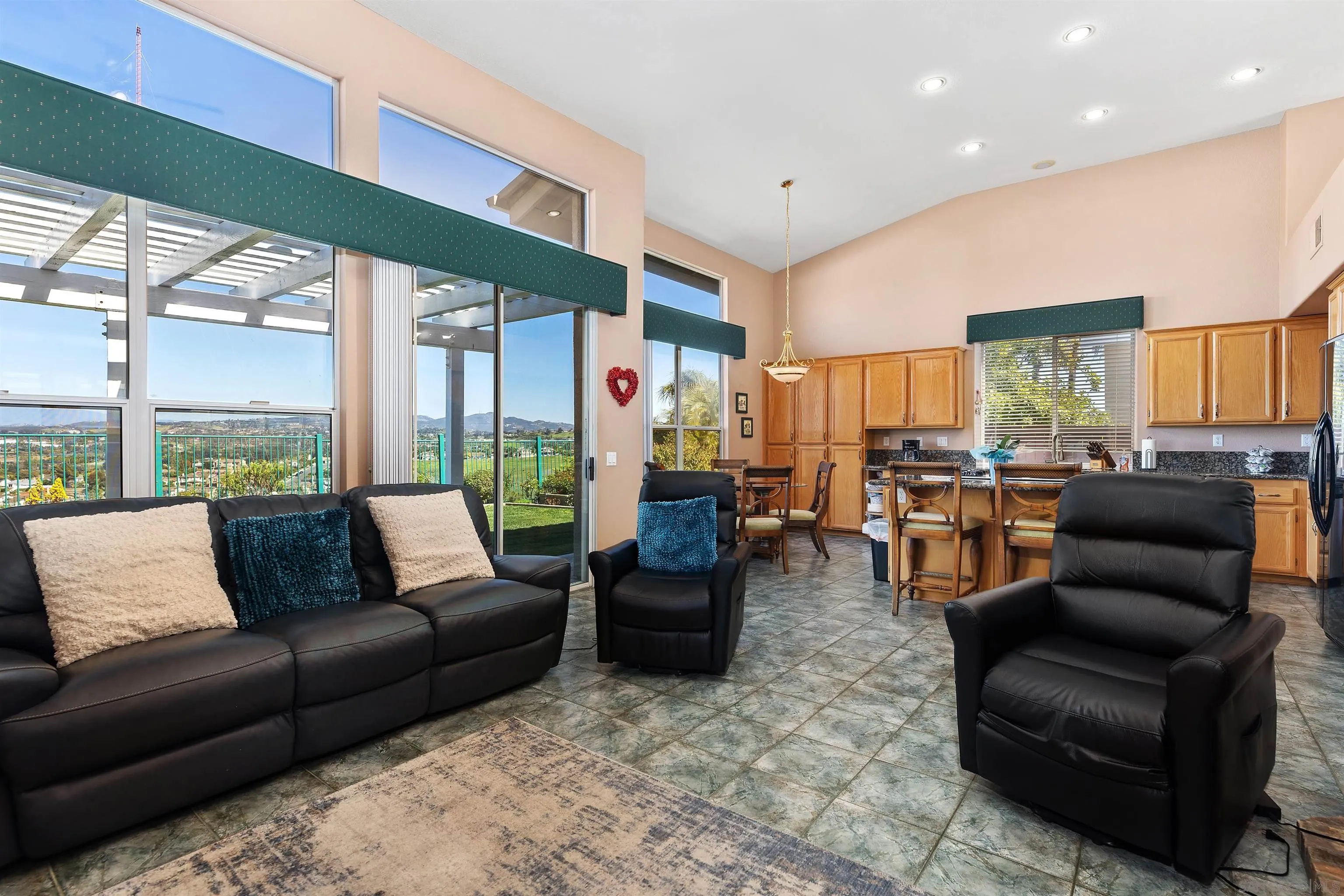 5213 Palmera Drive Oceanside, CA 92056 - Photo 14 of 38 a living room with furniture and a large window