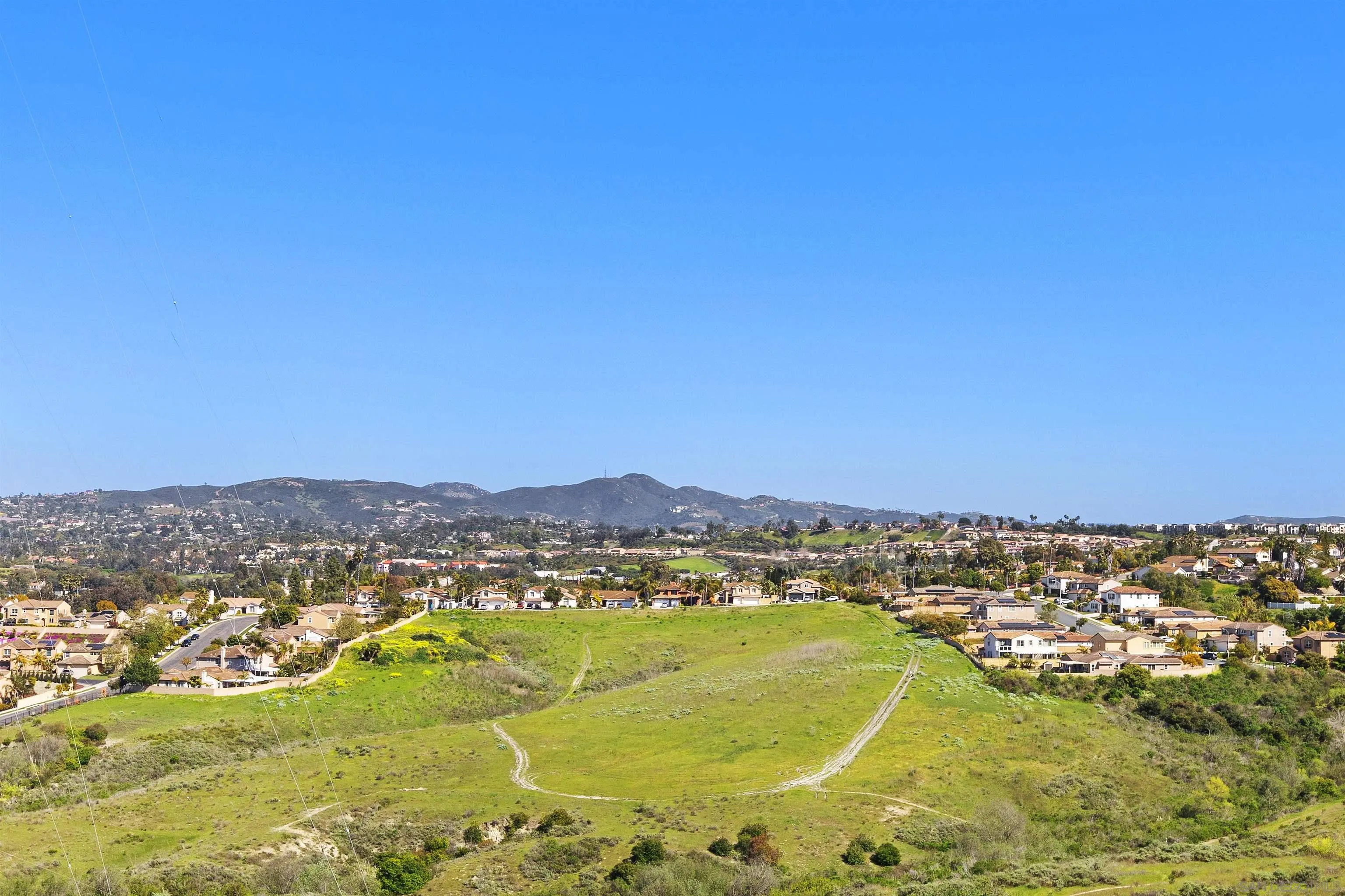 5213 Palmera Drive Oceanside, CA 92056 - Photo 2 of 38 a view of a city with mountains in the background