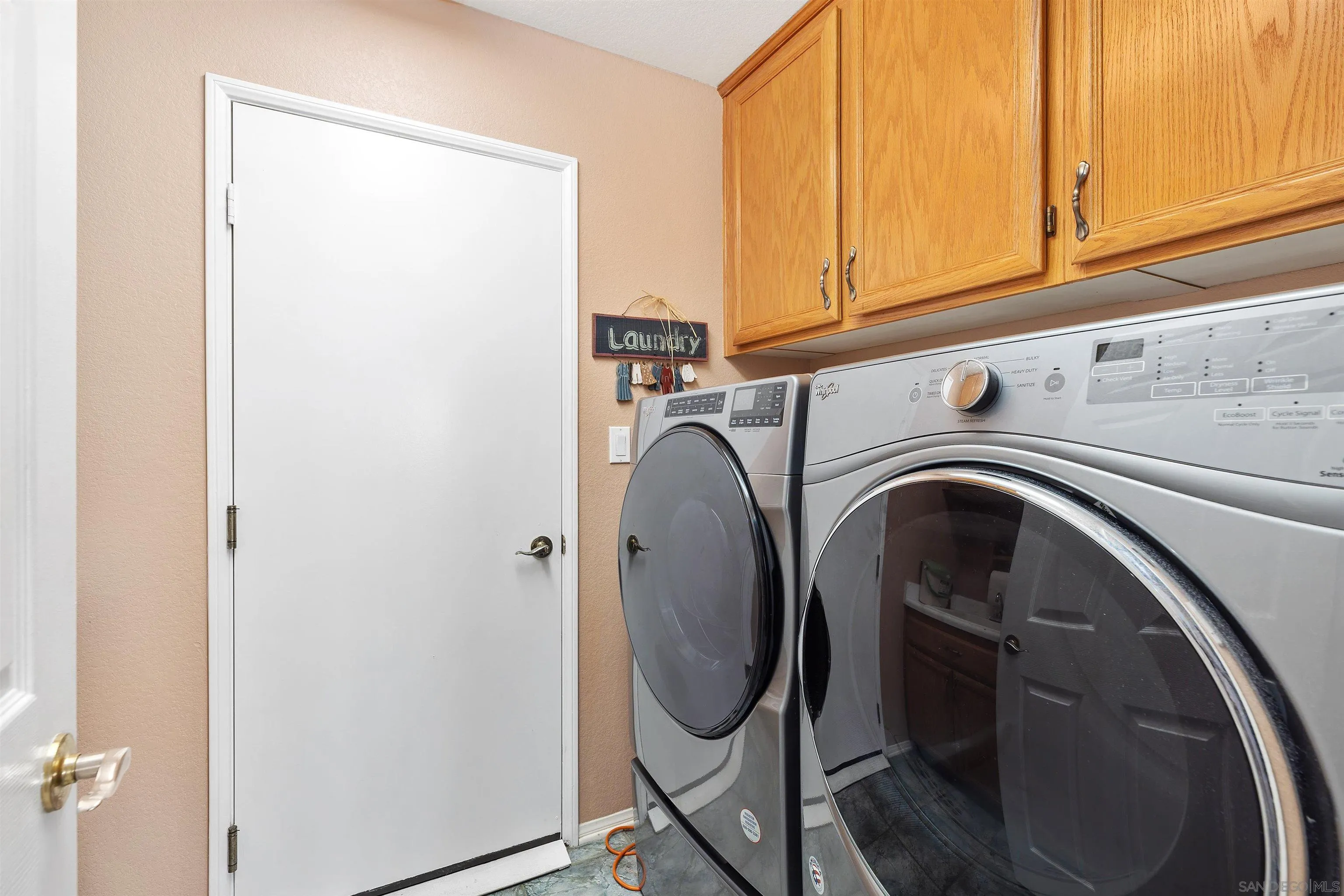 5213 Palmera Drive Oceanside, CA 92056 - Photo 24 of 38 a utility room with dryer and washer