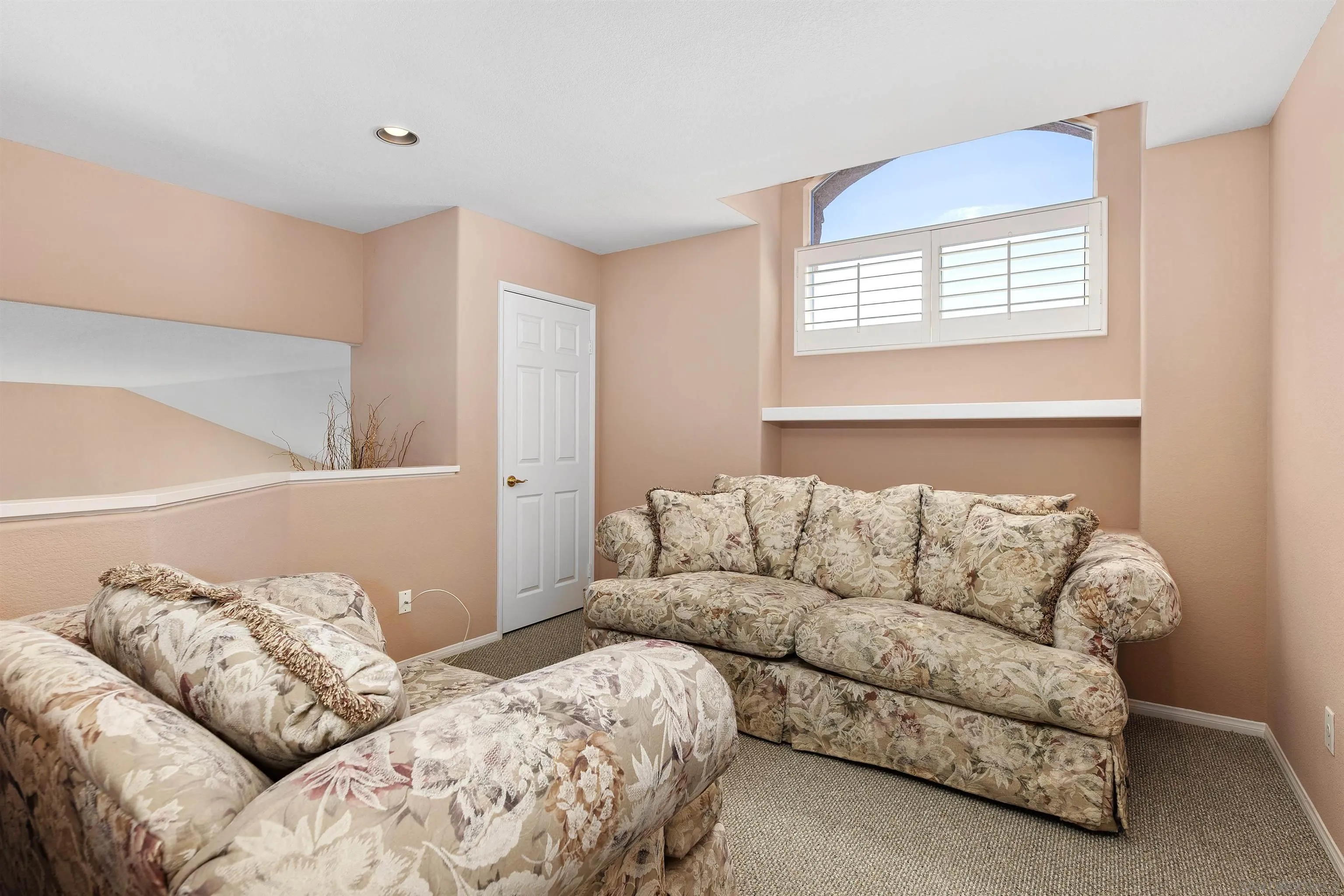 5213 Palmera Drive Oceanside, CA 92056 - Photo 25 of 38 a living room with a couch and a window