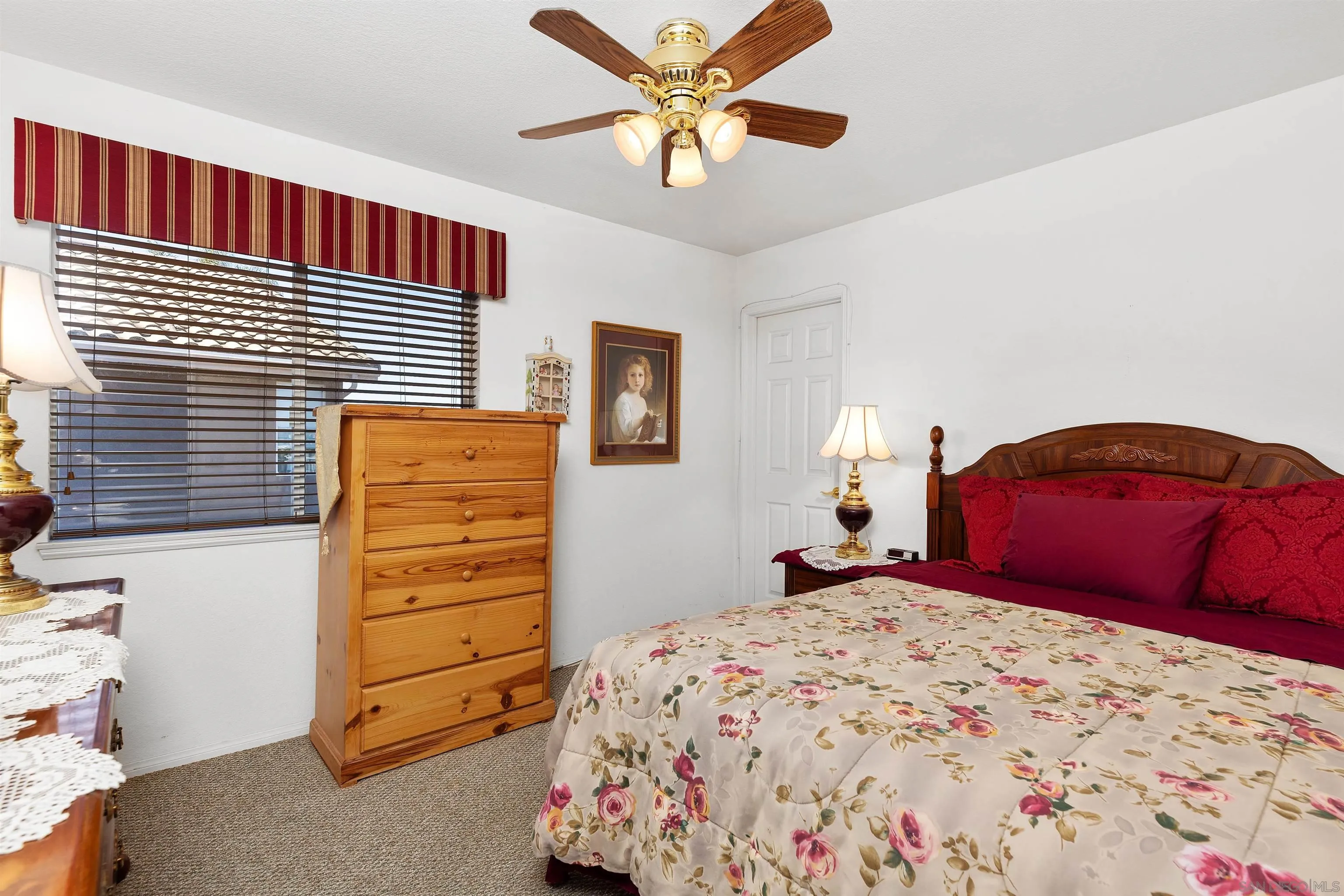 5213 Palmera Drive Oceanside, CA 92056 - Photo 29 of 38 a bedroom with a bed and a closet