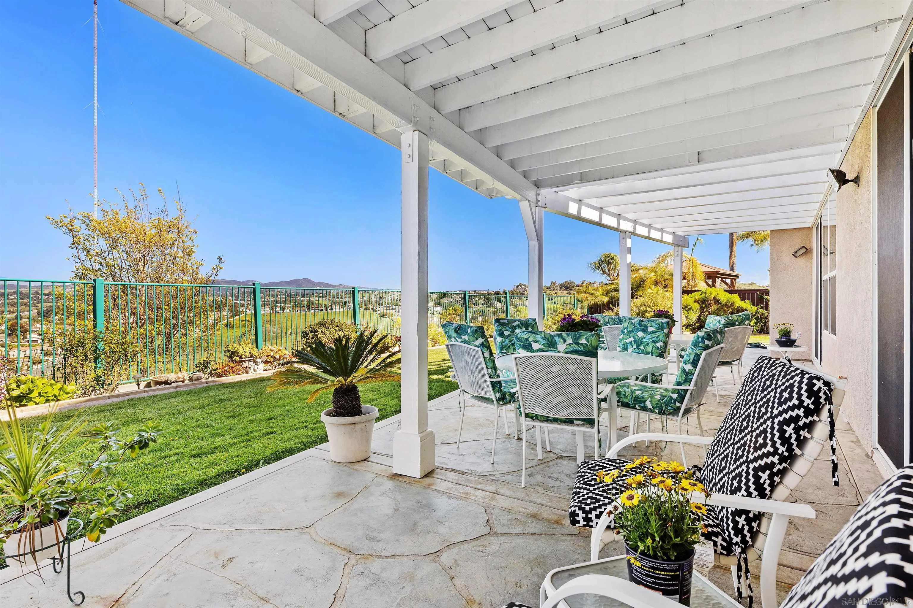 5213 Palmera Drive Oceanside, CA 92056 - Photo 35 of 38 a view of an chairs and table in patio