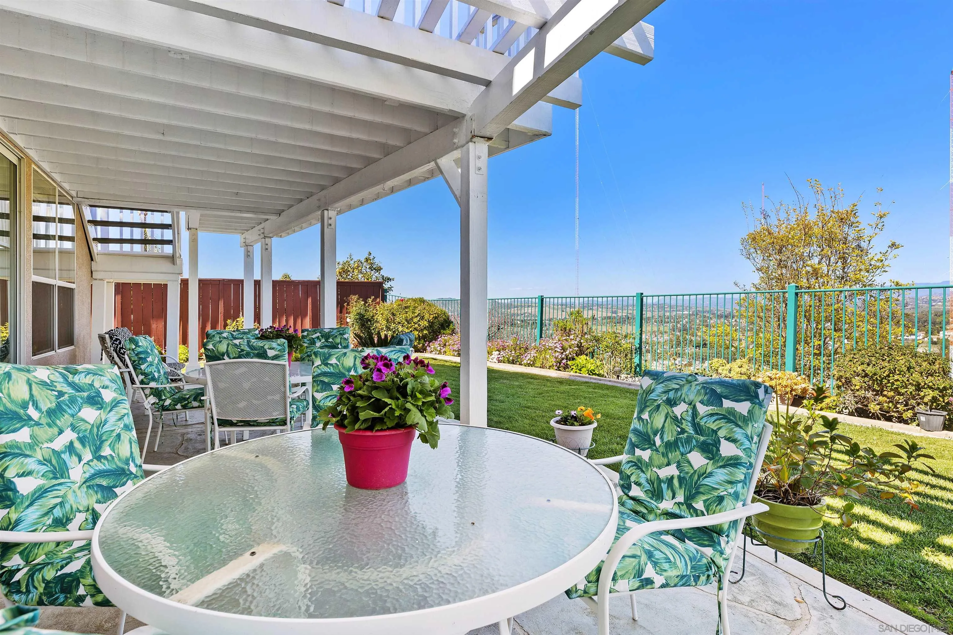 5213 Palmera Drive Oceanside, CA 92056 - Photo 36 of 38 a dining room with furniture and a potted plant