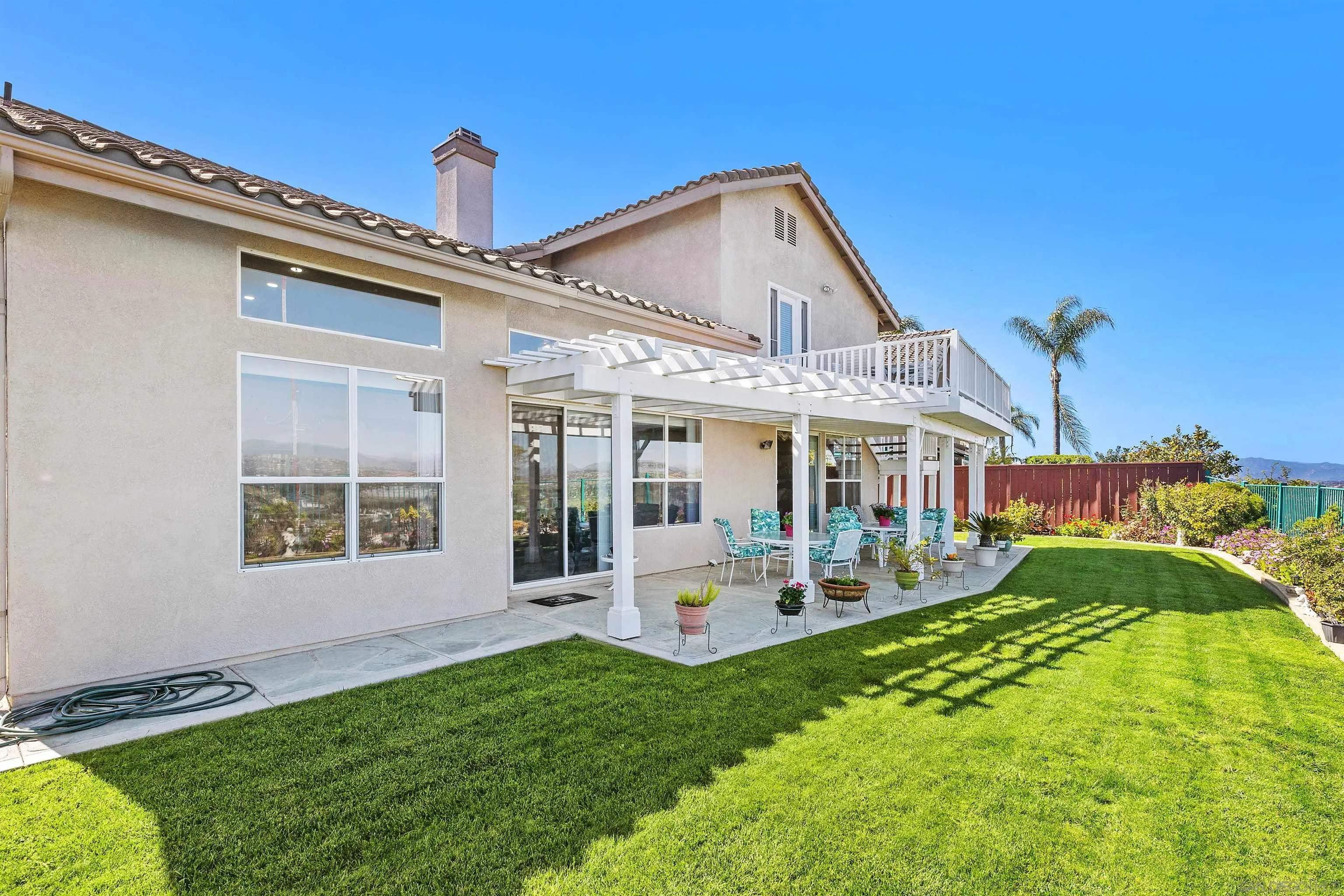 5213 Palmera Drive Oceanside, CA 92056 - Photo 38 of 38 a front view of a house with a yard