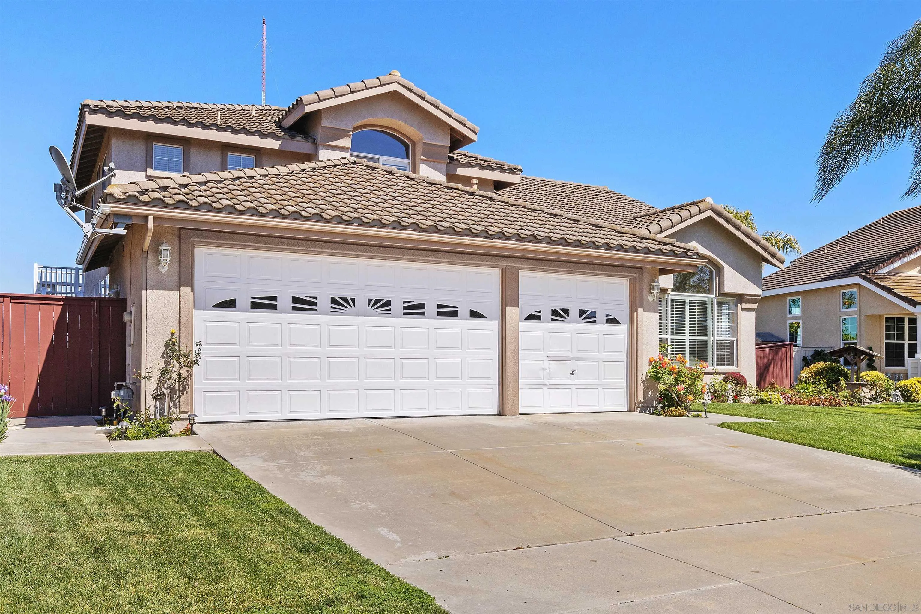 5213 Palmera Drive Oceanside, CA 92056 - Photo 5 of 38 a front view of a house with garden