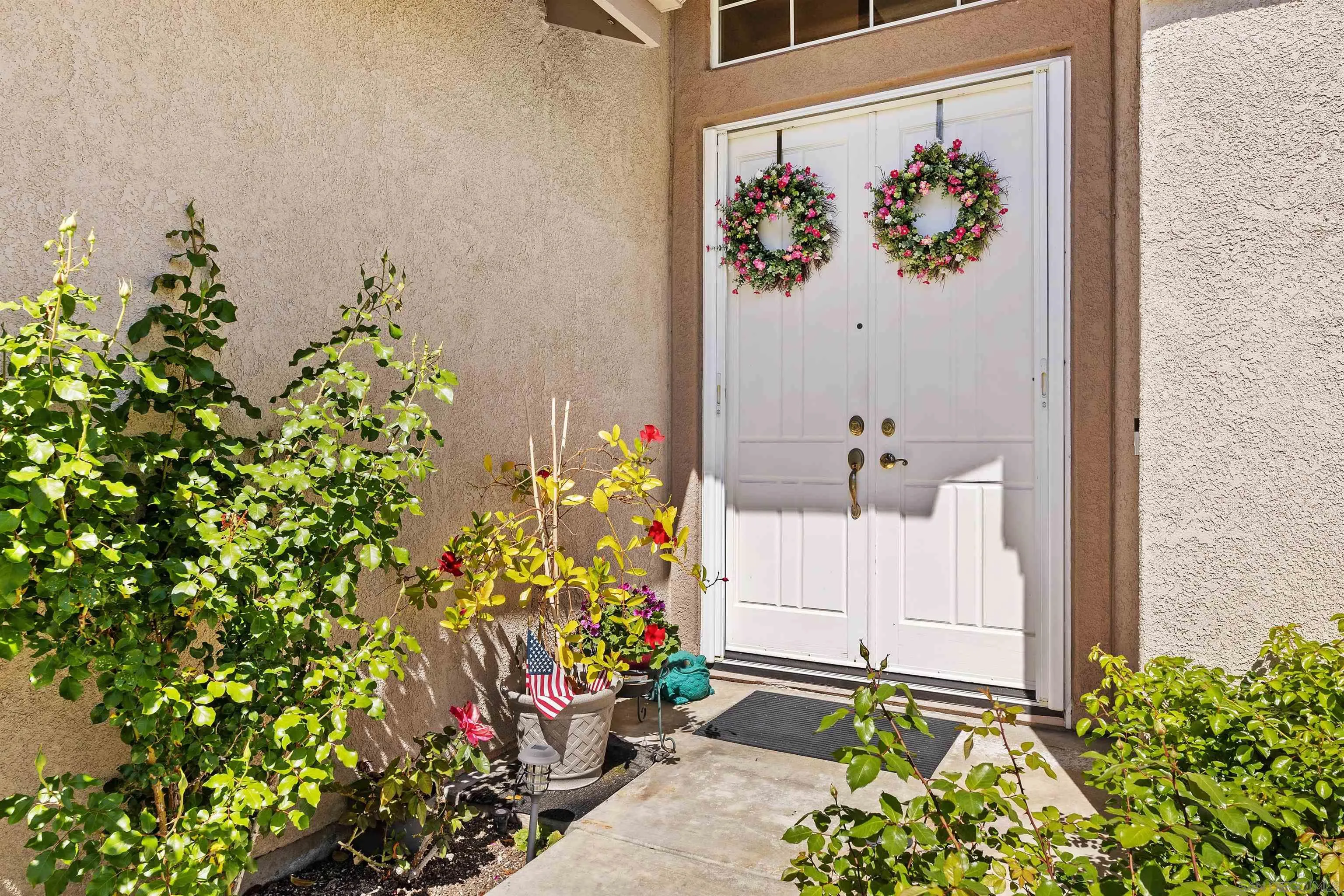 5213 Palmera Drive Oceanside, CA 92056 - Photo 6 of 38 view of a potted plant in front of a door