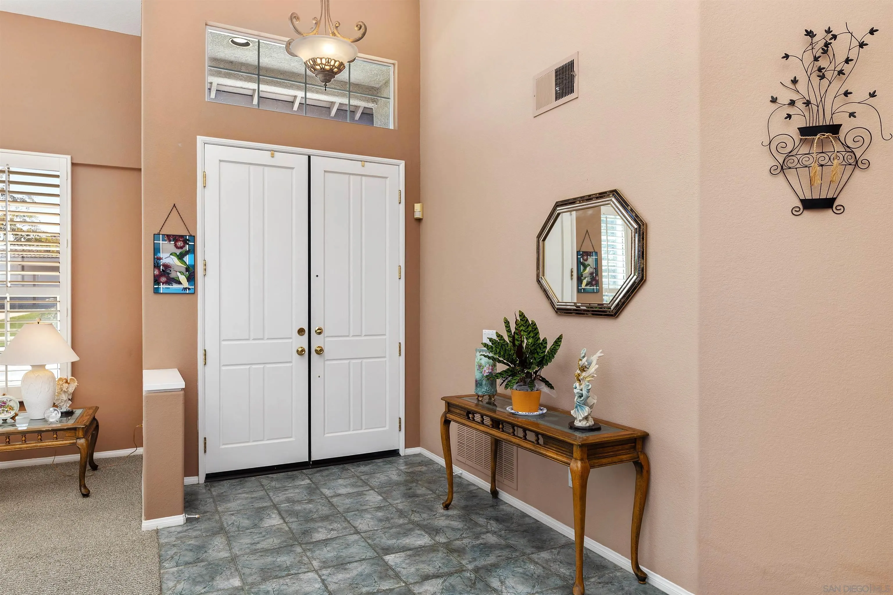 5213 Palmera Drive Oceanside, CA 92056 - Photo 8 of 38 a view of a livingroom with furniture and mirror