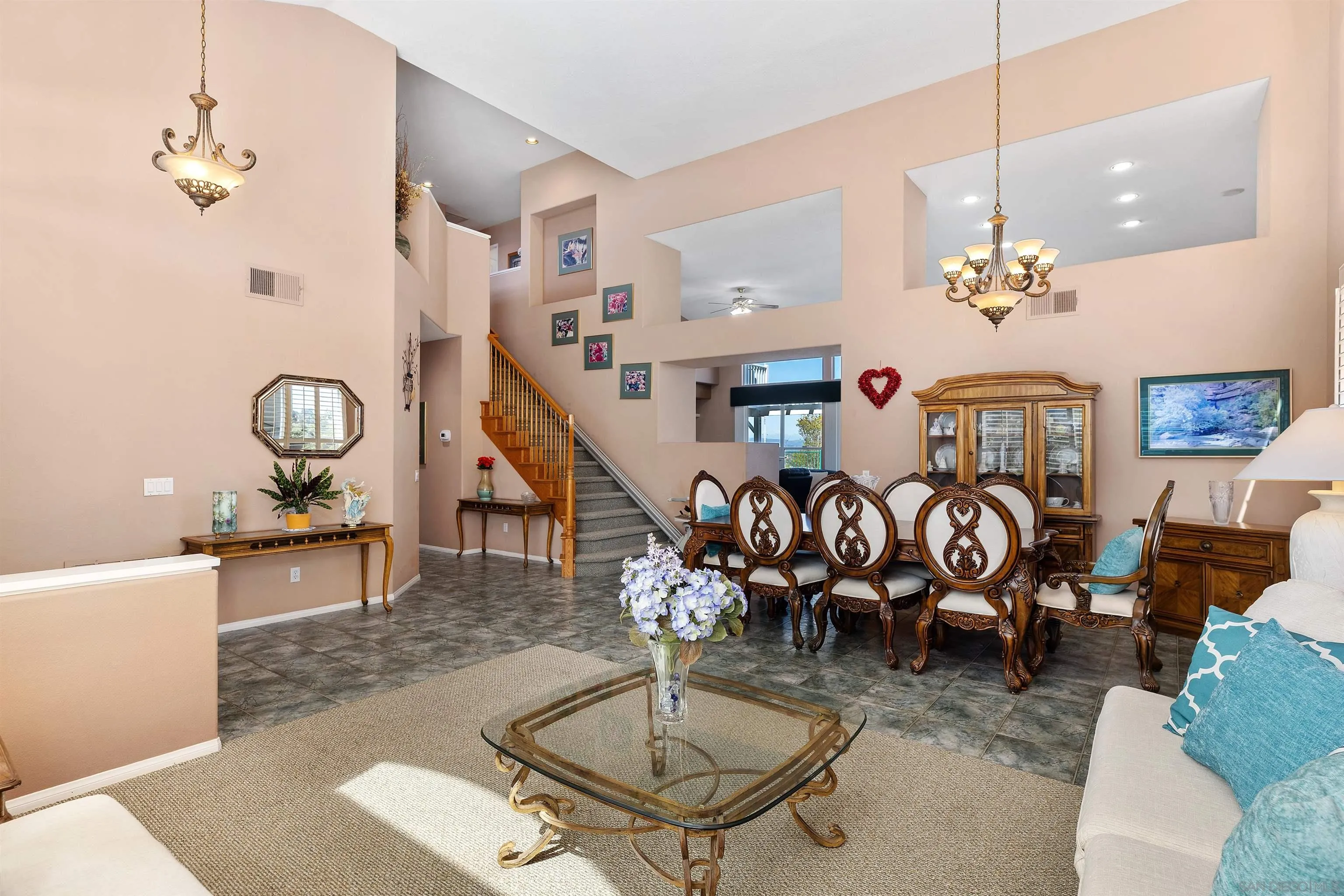 5213 Palmera Drive Oceanside, CA 92056 - Photo 10 of 38 a room with lots of furniture and chandelier