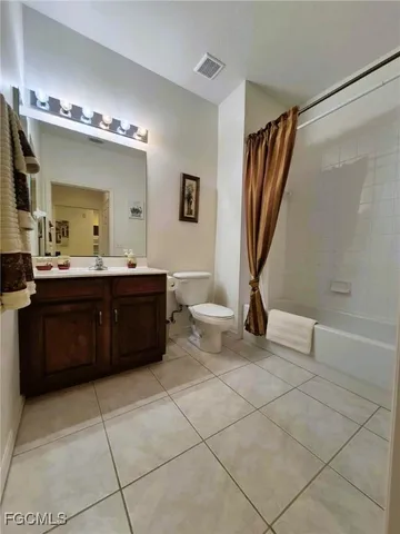 a spacious bathroom with a sink a mirror and a shower