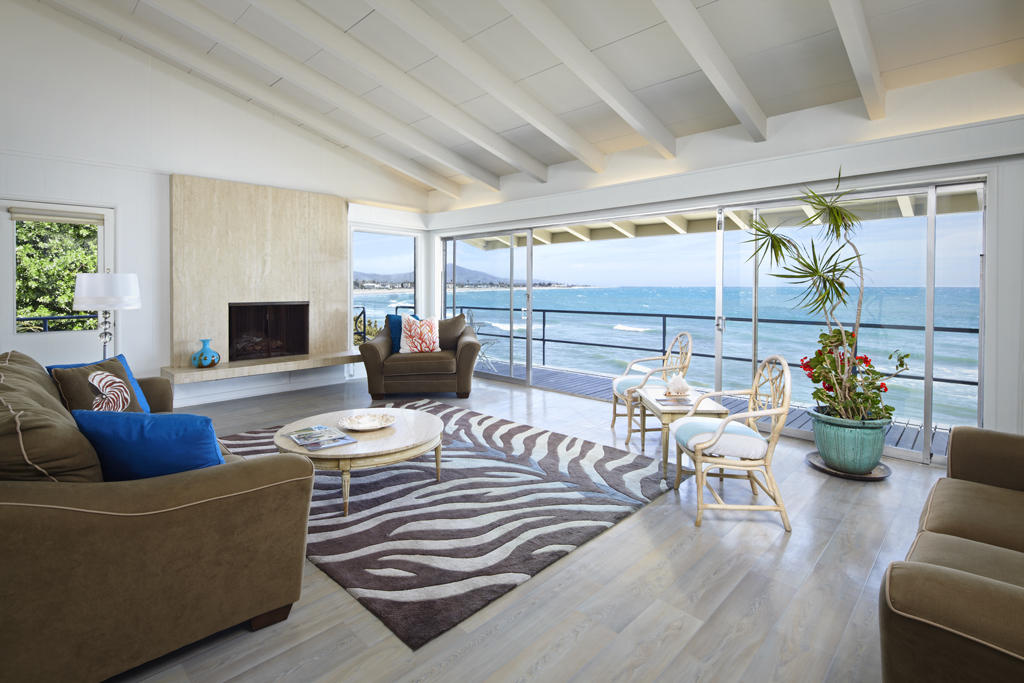 3246 Beach Club Road Carpinteria, CA 93013 - Photo 3 of 7 a living room with furniture and a fireplace