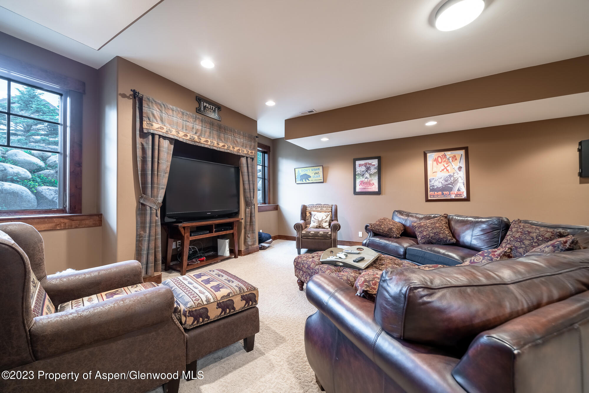 1720 Eagle Ranch Road Eagle, CO 81631 - Photo 16 of 18 a living room with furniture and a flat screen tv