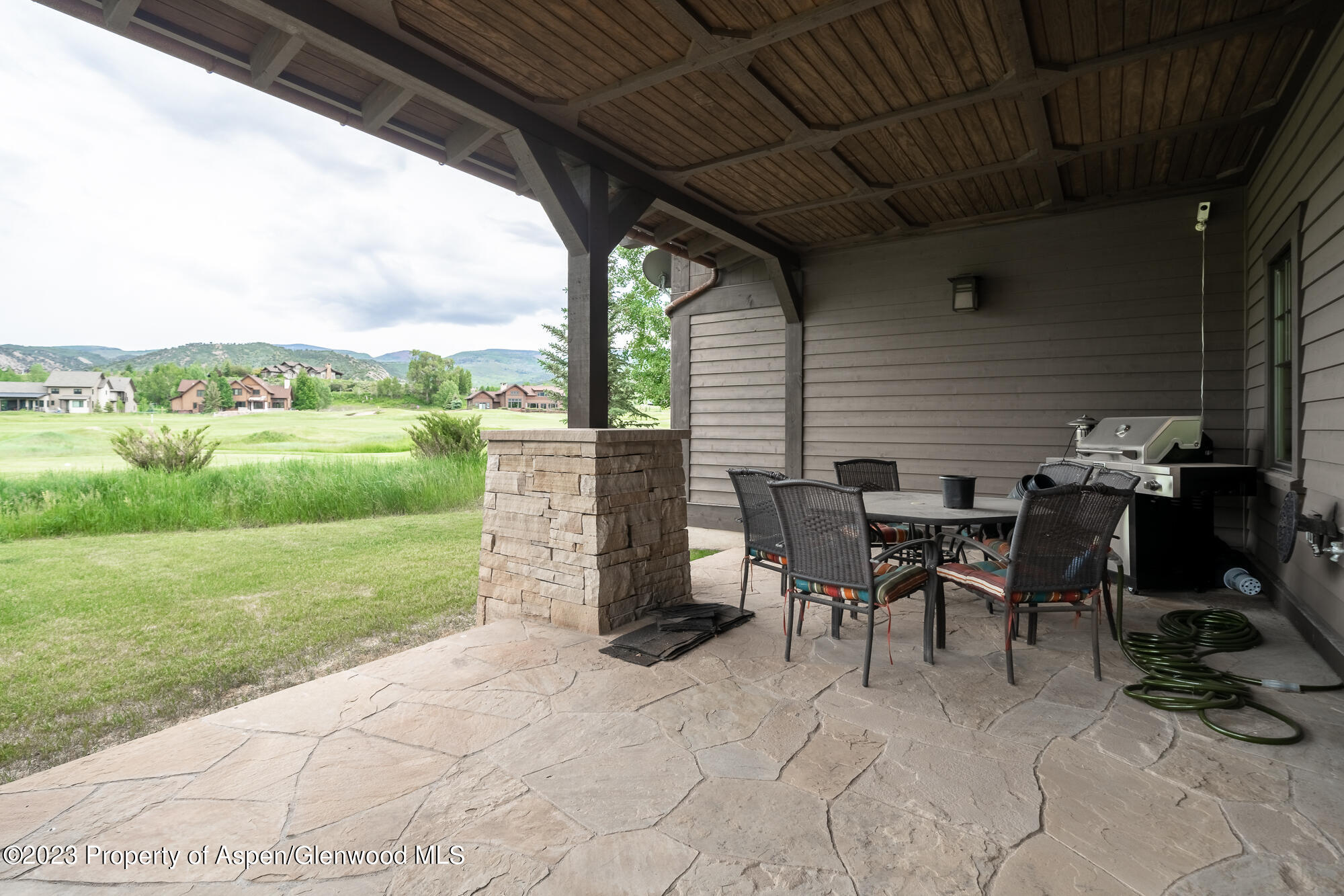 1720 Eagle Ranch Road Eagle, CO 81631 - Photo 18 of 18 a view of a patio with table and chairs a barbeque grill with wooden fence