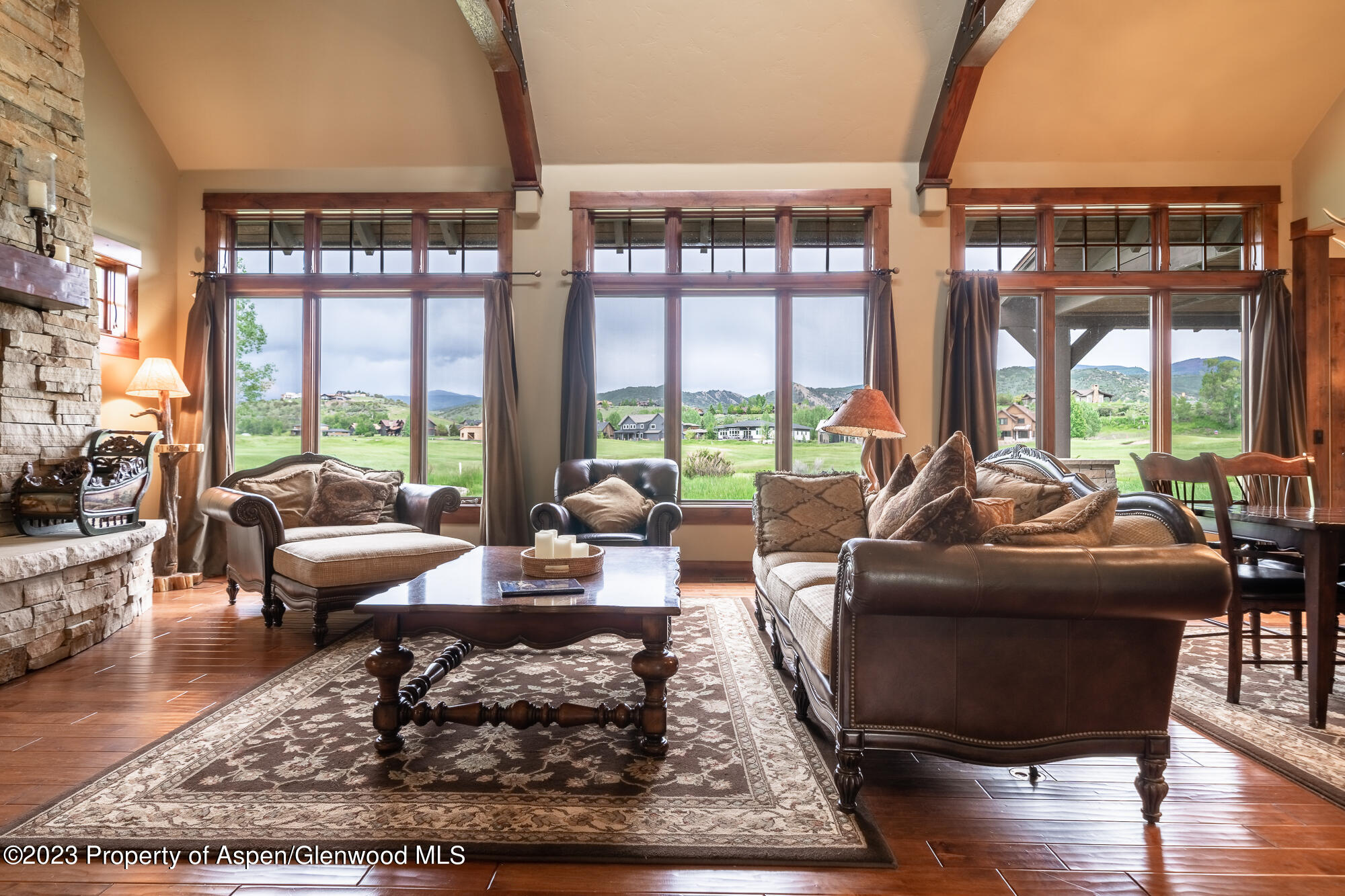 1720 Eagle Ranch Road Eagle, CO 81631 - Photo 3 of 18 a living room with furniture large windows and wooden floor