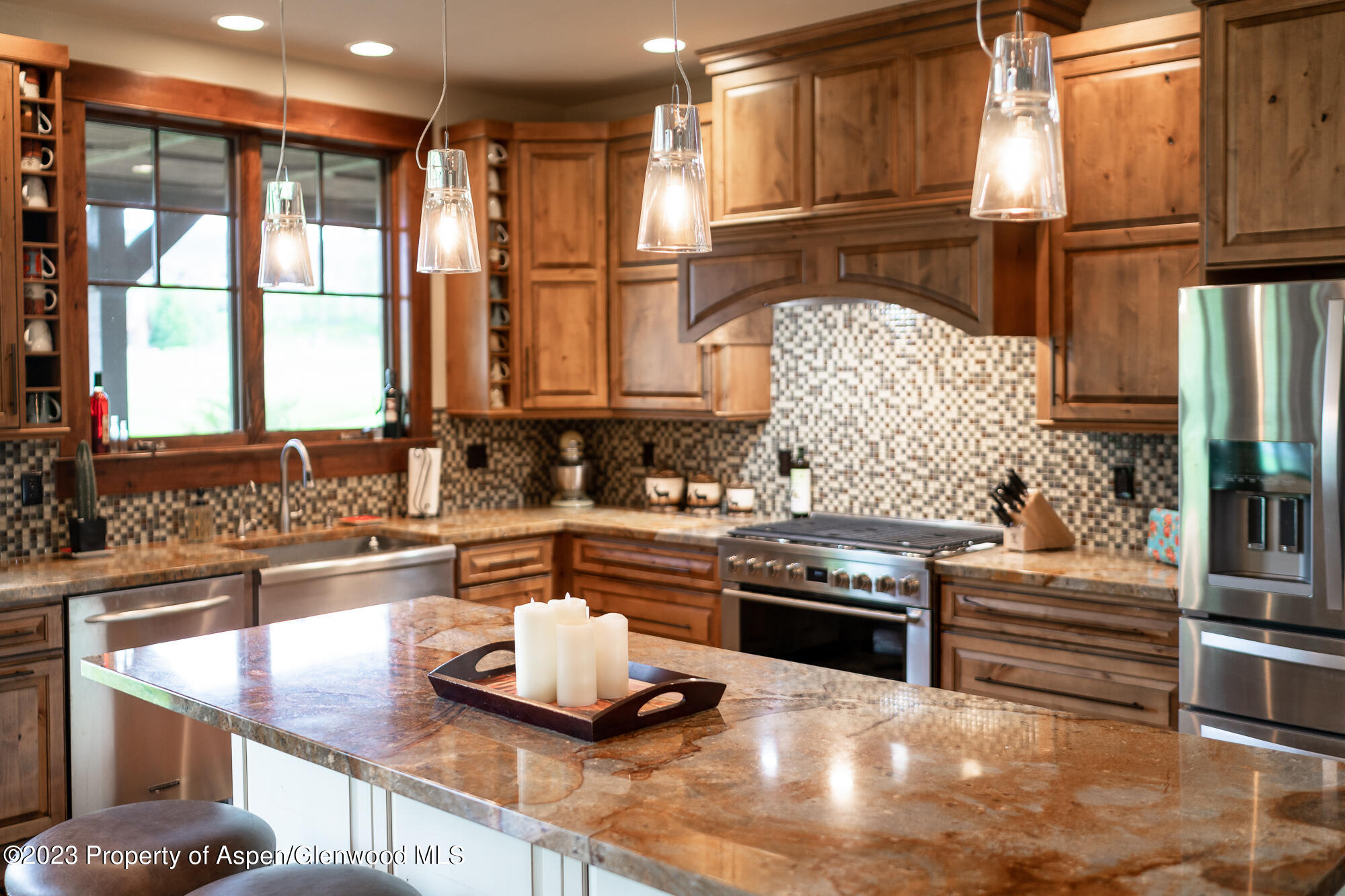 1720 Eagle Ranch Road Eagle, CO 81631 - Photo 9 of 18 a kitchen with stainless steel appliances granite countertop a sink and a stove