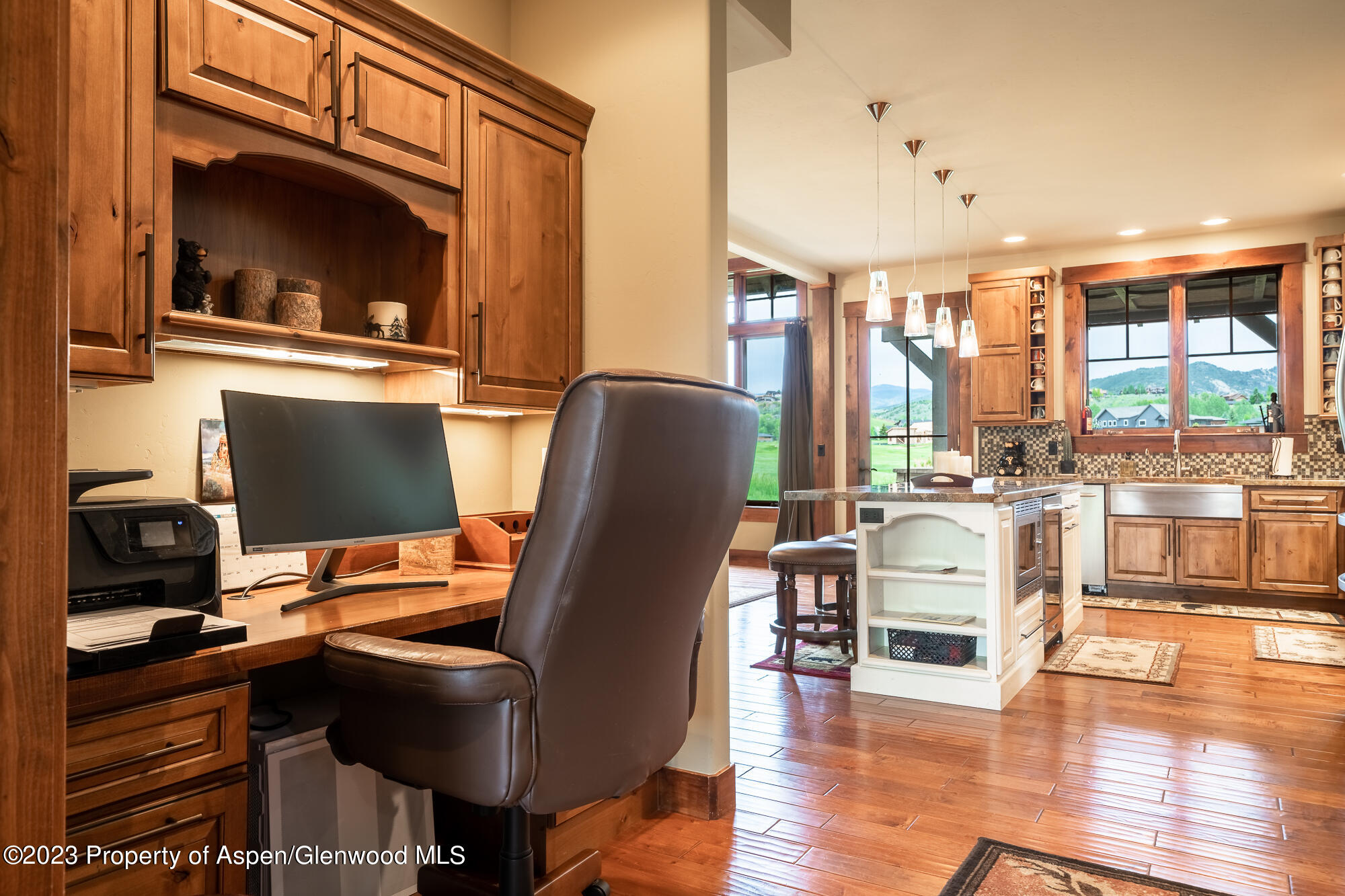 1720 Eagle Ranch Road Eagle, CO 81631 - Photo 10 of 18 a work room with furniture and a flat screen tv
