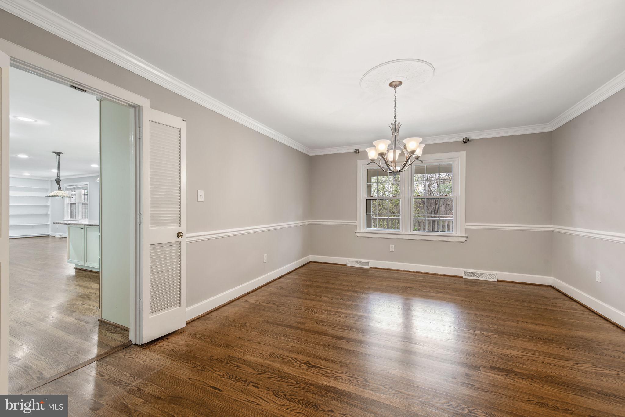 2821 Rifle Ridge Road Oakton, VA 22124 - Photo 8 of 56 Dining room with chair rail, crown molding