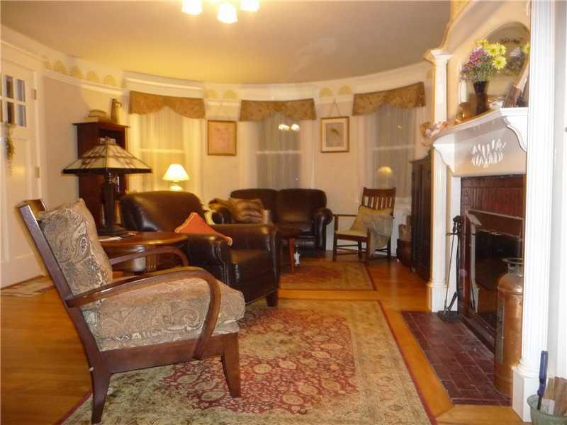 1400 State Road Eliot, ME 03903 - Photo 4 of 31 Living Room. The rounded windows in...