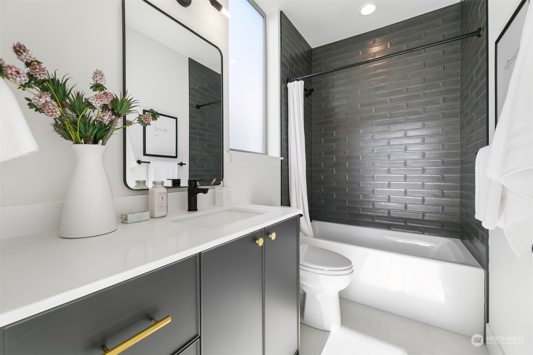3207 37th Place South Seattle, WA 98144 - Photo 19 of 38 a bathroom with a sink a toilet and shower