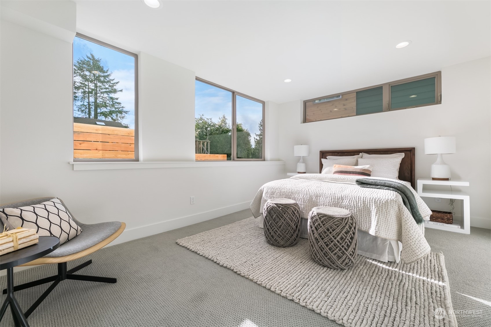3207 37th Place South Seattle, WA 98144 - Photo 24 of 38 a bedroom with a bed and wooden floor