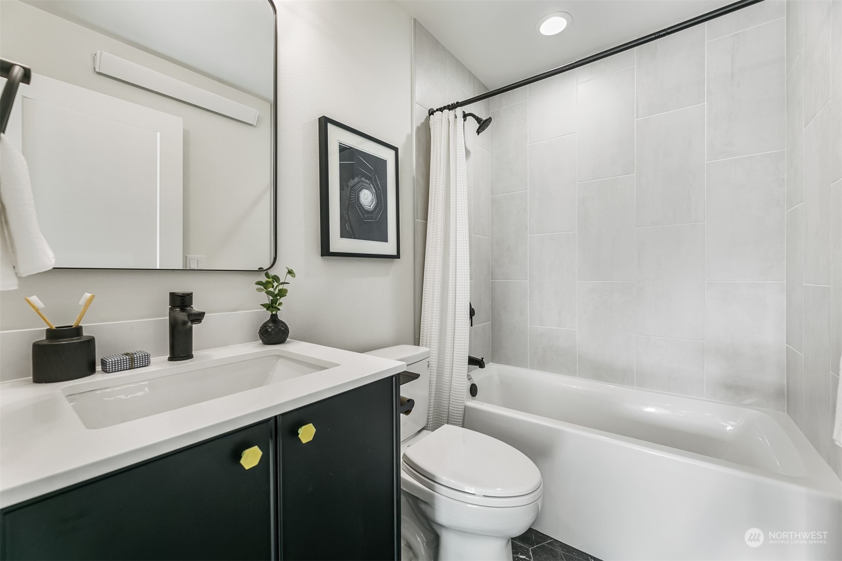 3207 37th Place South Seattle, WA 98144 - Photo 26 of 38 a bathroom with a sink a toilet and shower