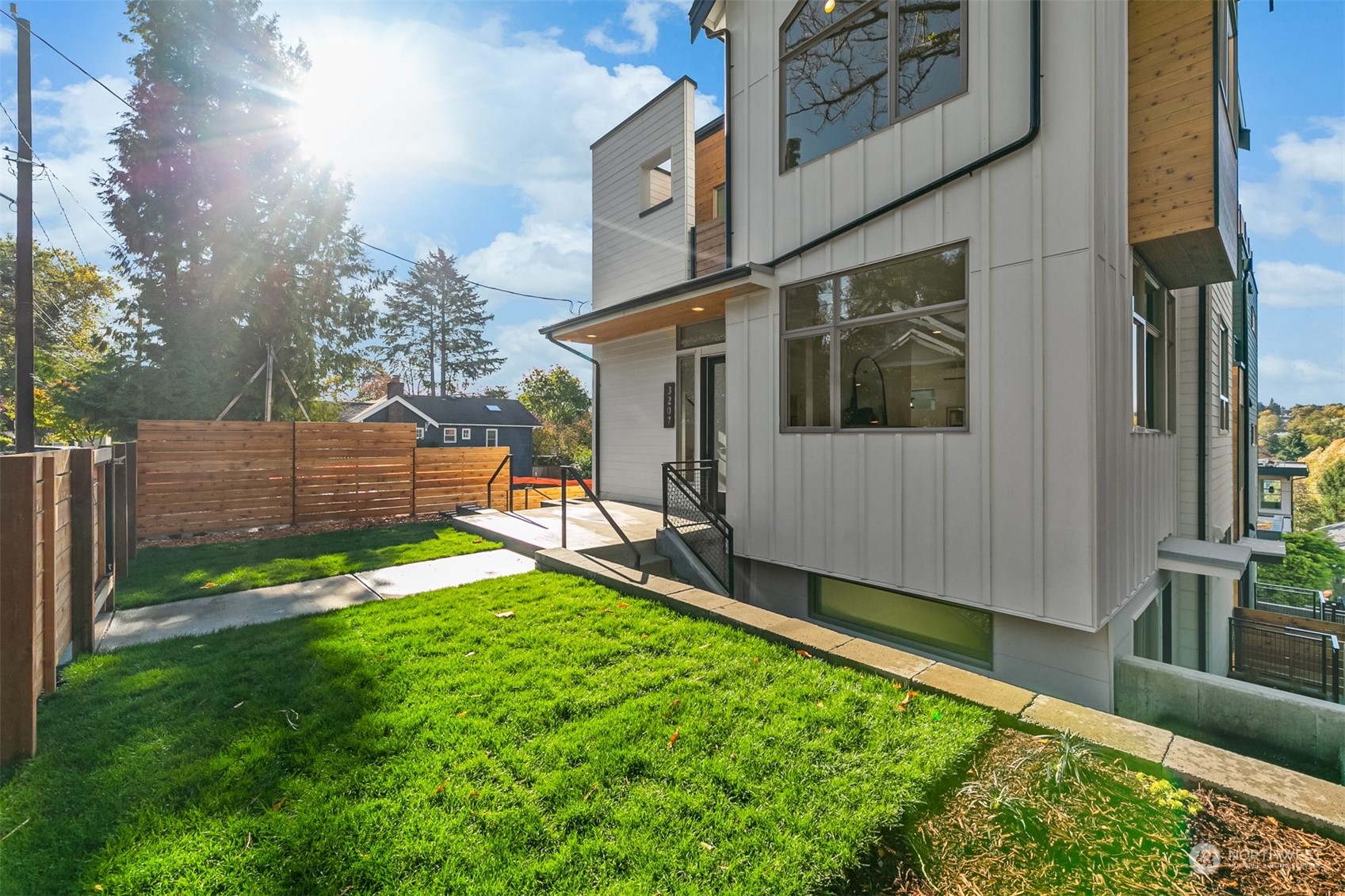 3207 37th Place South Seattle, WA 98144 - Photo 34 of 38 a view of back yard of the house with an outdoor seating