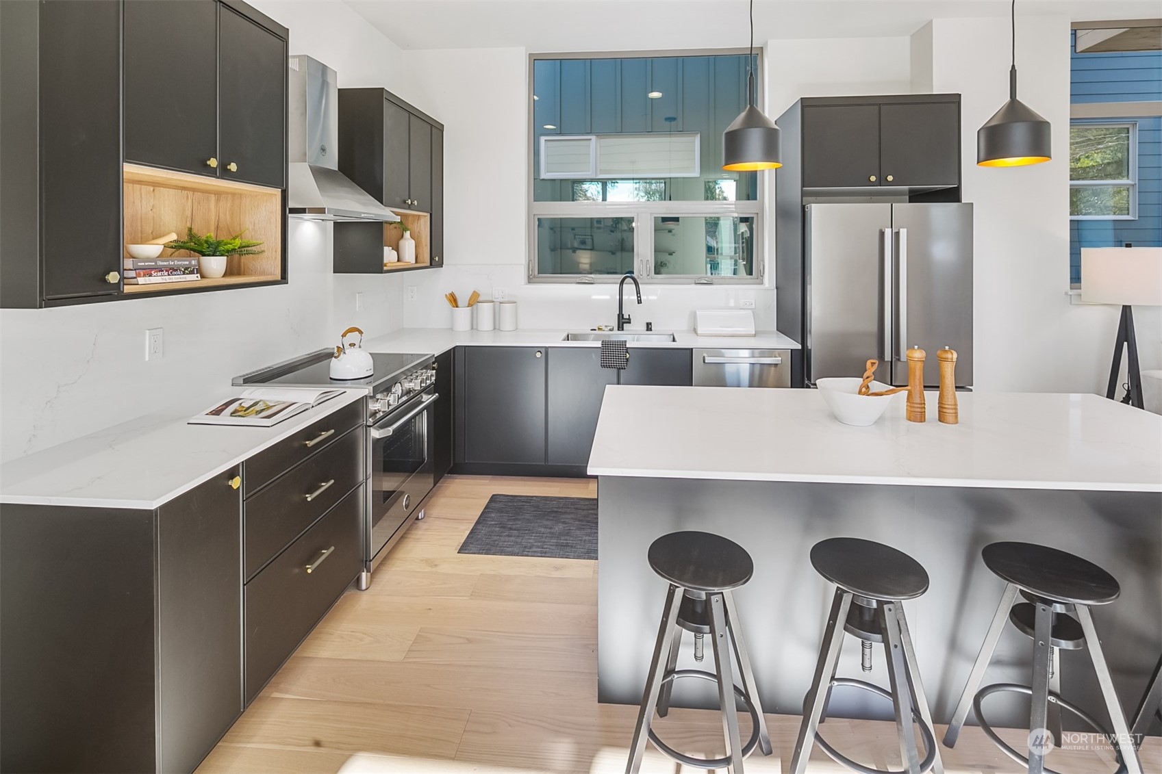 3207 37th Place South Seattle, WA 98144 - Photo 6 of 38 a kitchen with stainless steel appliances a stove a sink and a refrigerator