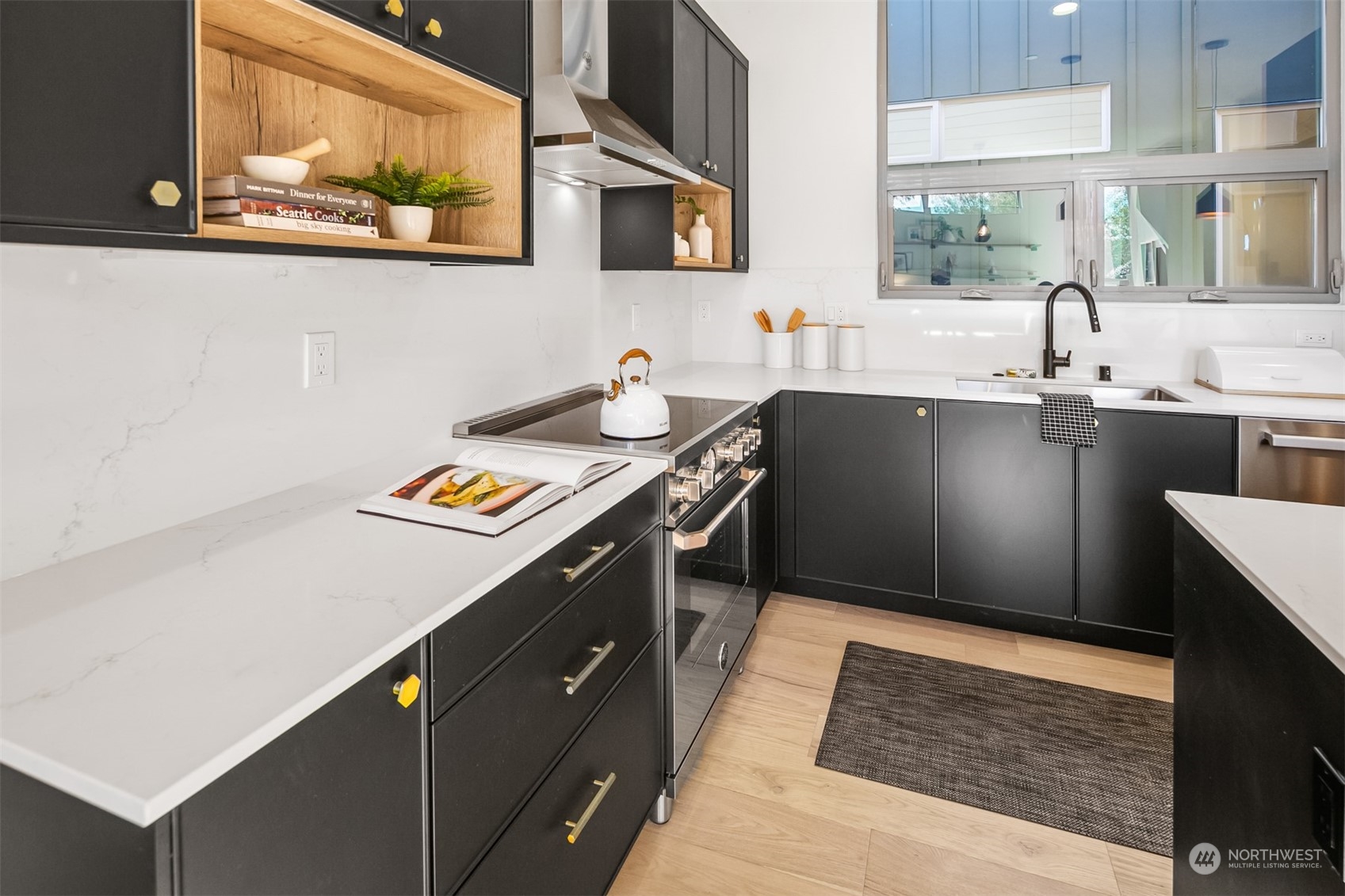 3207 37th Place South Seattle, WA 98144 - Photo 7 of 38 a kitchen with stainless steel appliances granite countertop a sink stove and cabinets