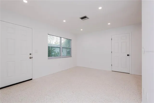 an empty room with windows