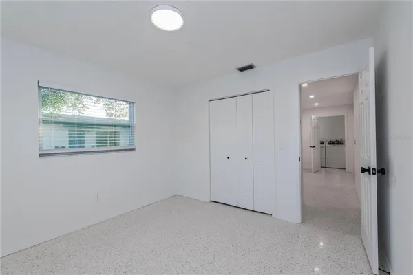 a view of an empty room with a window