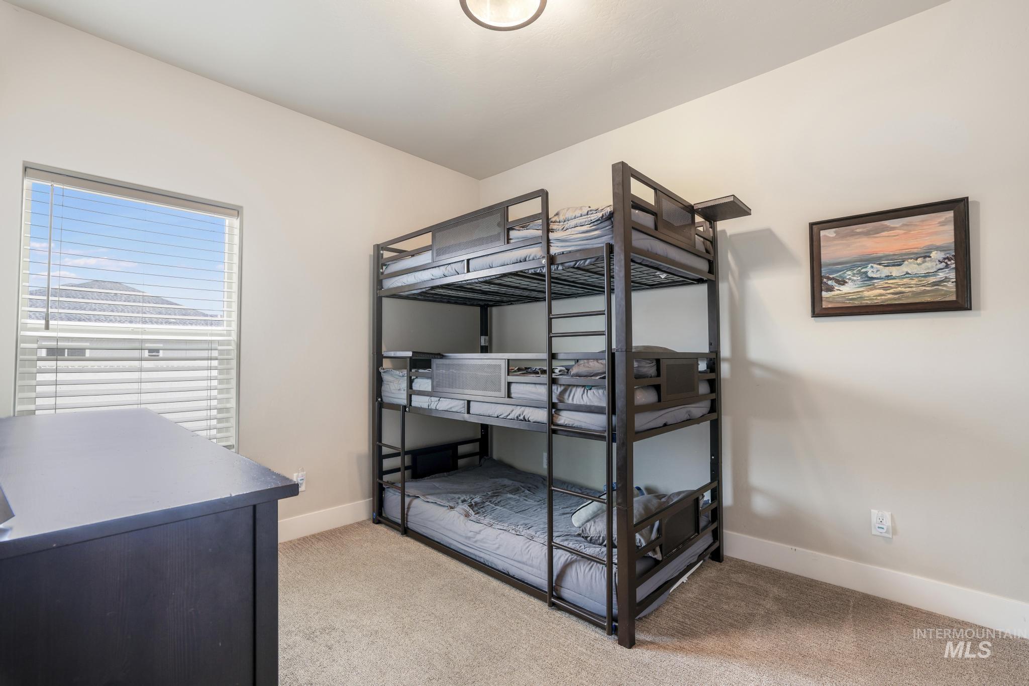3103 Moonrise Road Twin Falls, ID 83301 - Photo 25 of 40 Bedroom featuring light colored carpet and baseboards