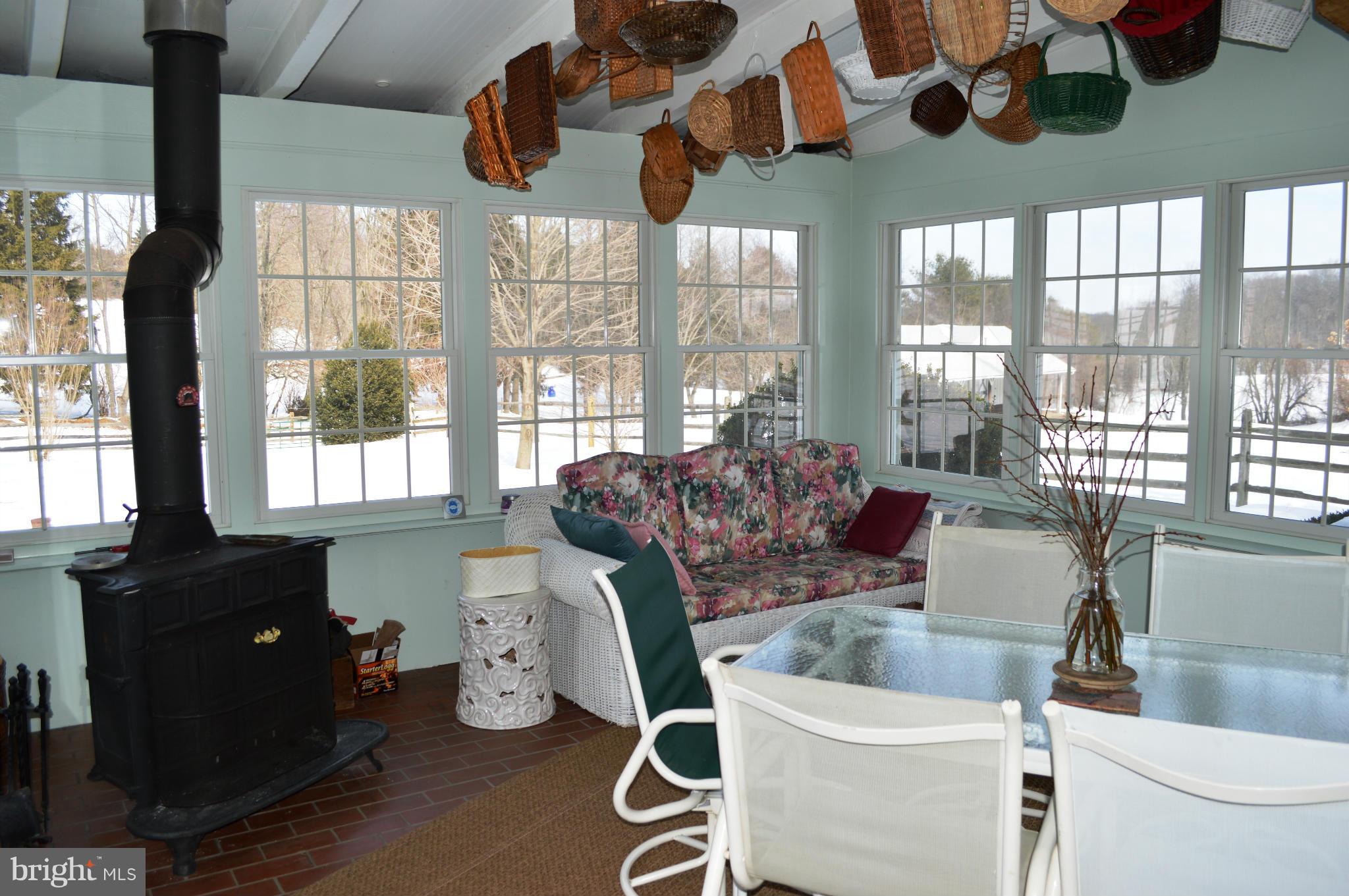 3210 Mt Zion Road Upperco, MD 21155 - Photo 14 of 30 a living room with furniture and a floor to ceiling window