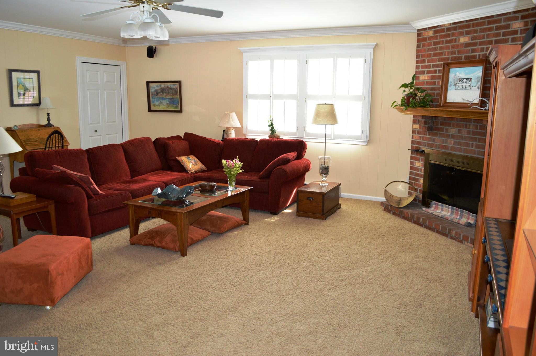 3210 Mt Zion Road Upperco, MD 21155 - Photo 22 of 30 a living room with furniture and a fireplace