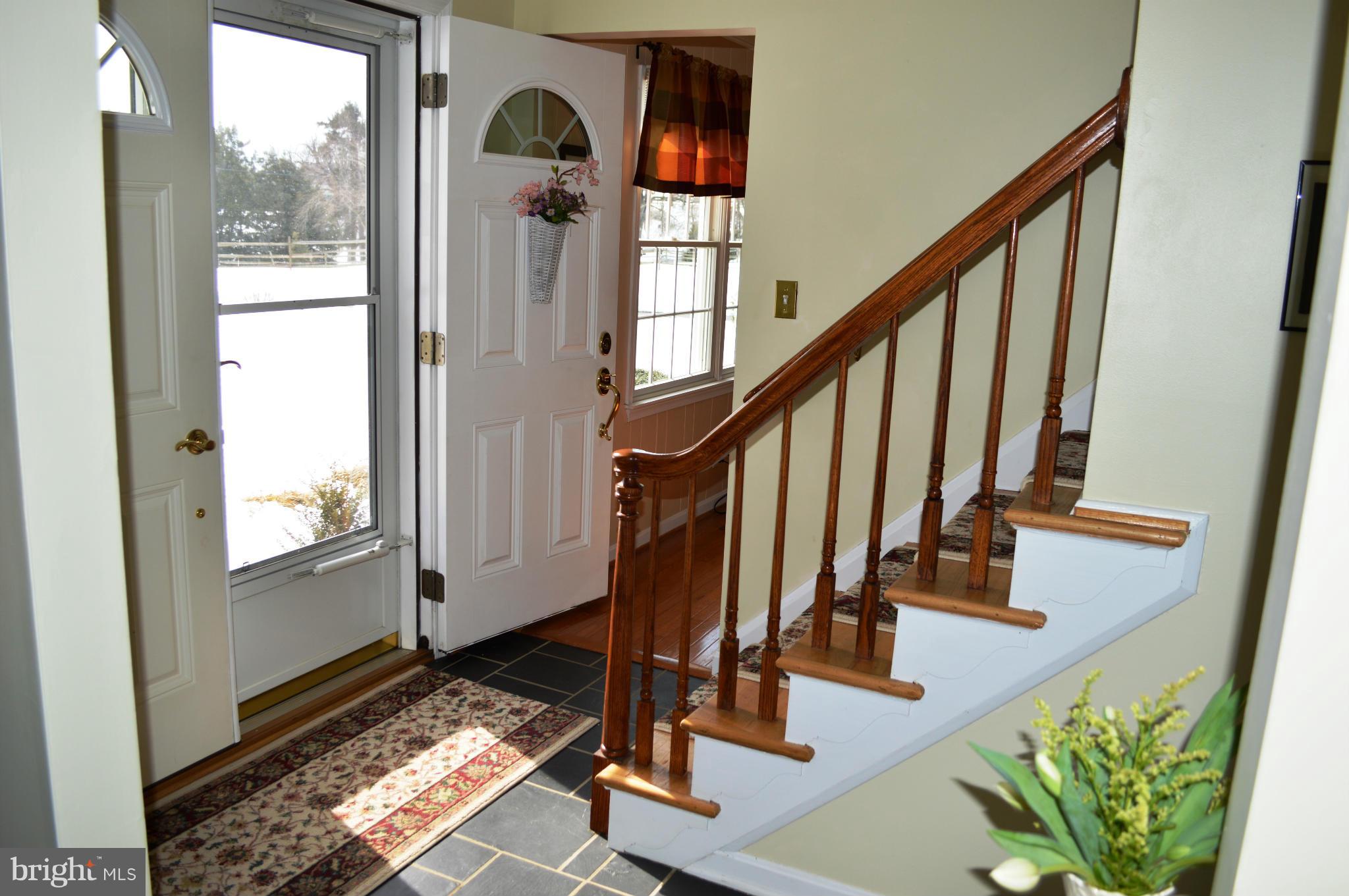 3210 Mt Zion Road Upperco, MD 21155 - Photo 4 of 30 a view of staircase with furniture and a window