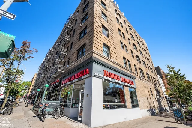 a view of a street with shops