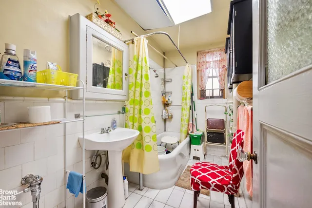 a bathroom with a sink toilet and mirror