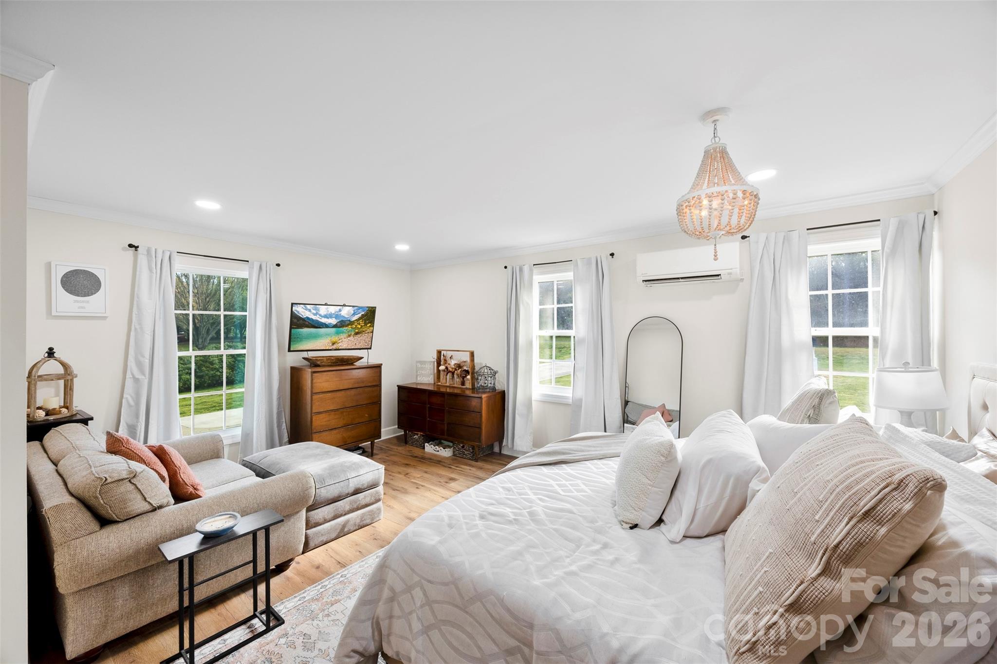 123 Chestnut Ridge Road Kings Mountain, NC 28086 - Photo 11 of 36 a bedroom with furniture a fireplace and a large window