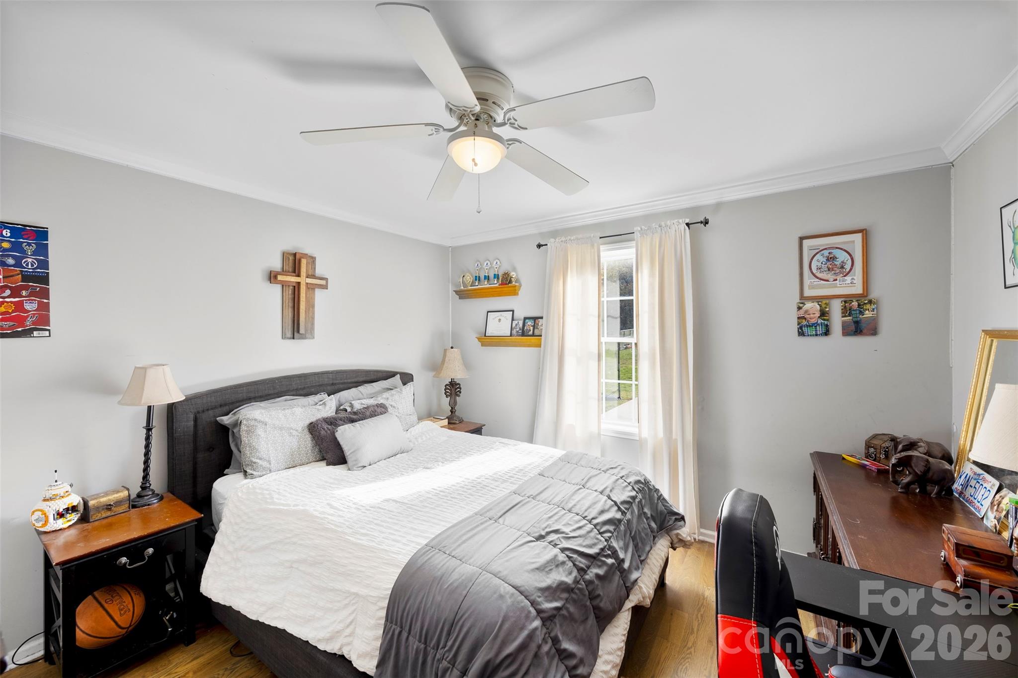 123 Chestnut Ridge Road Kings Mountain, NC 28086 - Photo 20 of 36 a bedroom with a bed and a chandelier