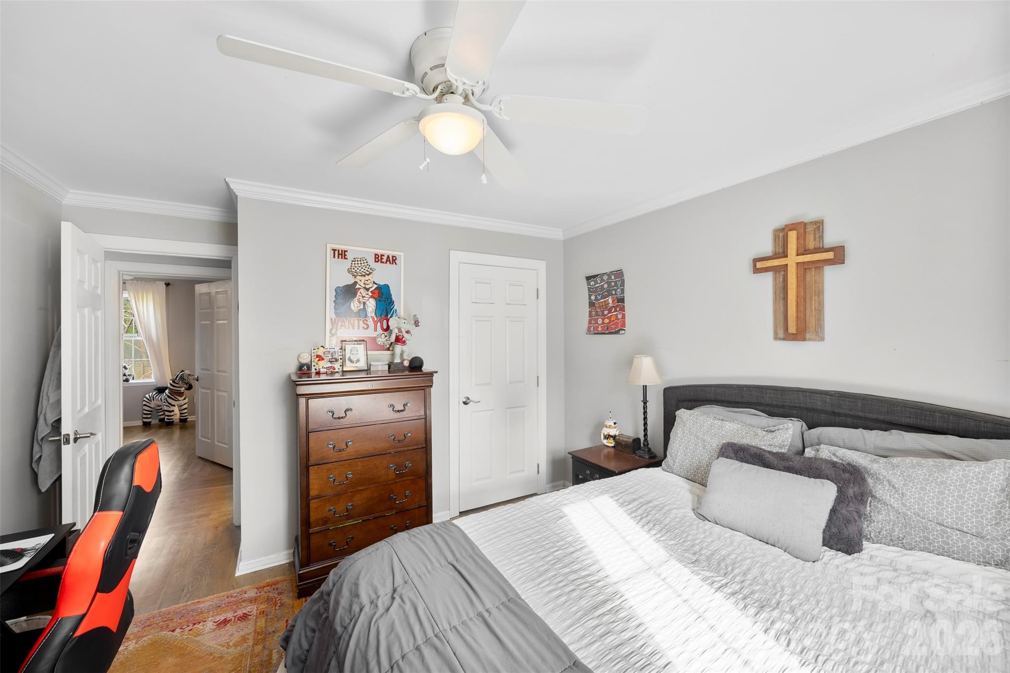 123 Chestnut Ridge Road Kings Mountain, NC 28086 - Photo 21 of 36 a bedroom with a bed and a chandelier