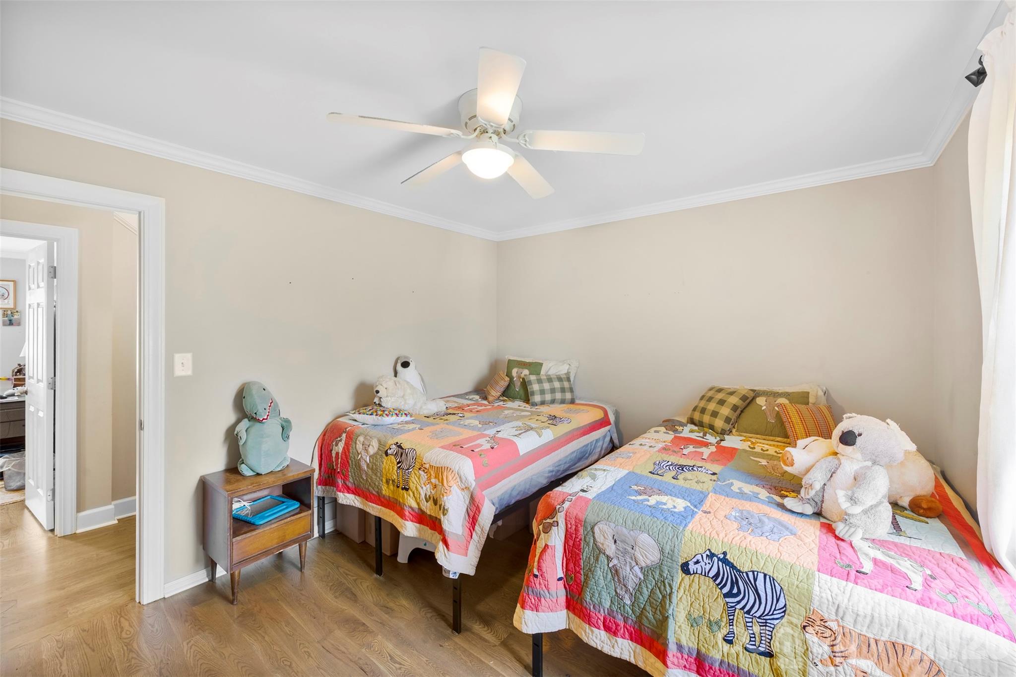 123 Chestnut Ridge Road Kings Mountain, NC 28086 - Photo 22 of 36 a bedroom with two beds and a chandelier