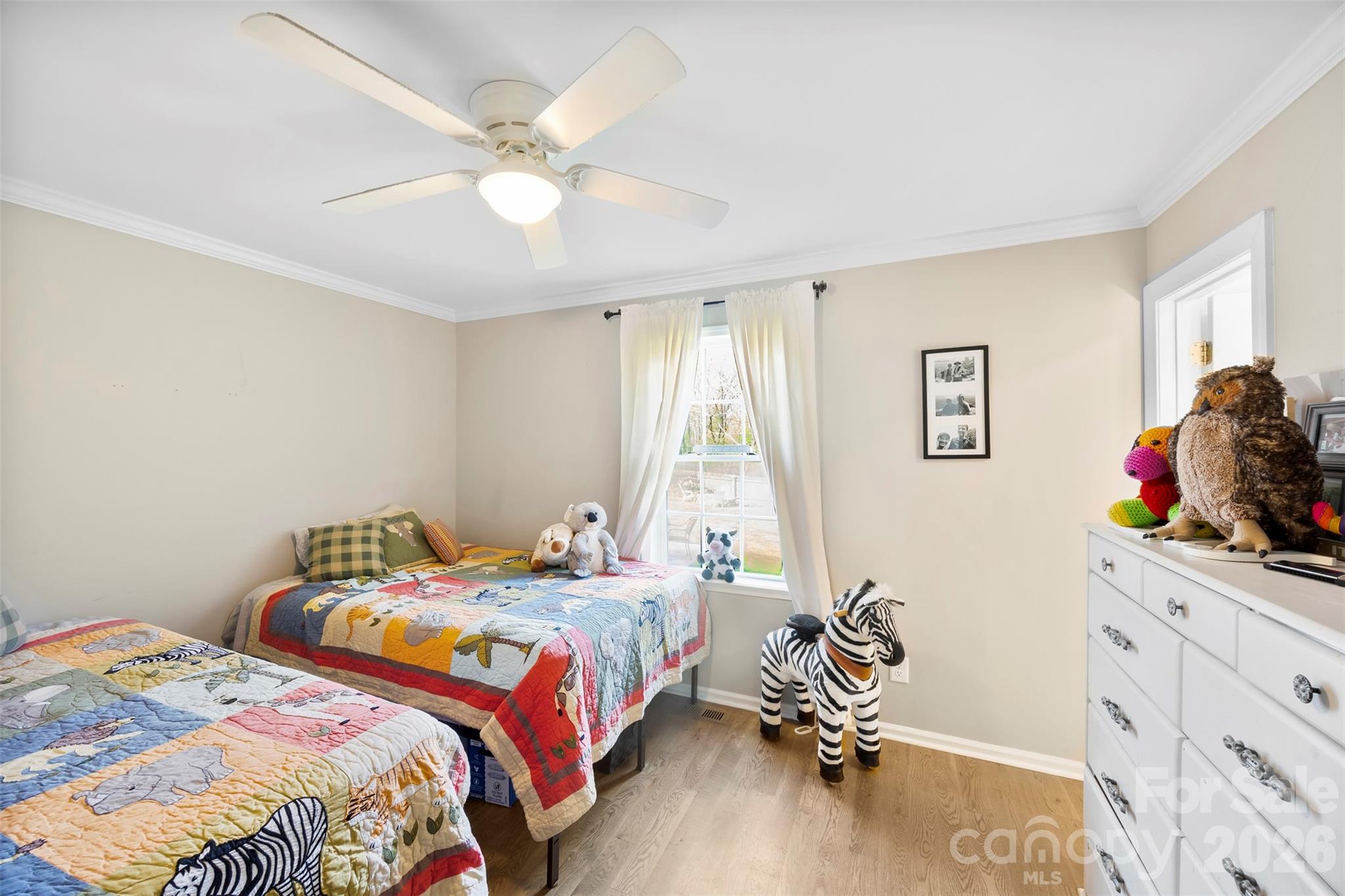 123 Chestnut Ridge Road Kings Mountain, NC 28086 - Photo 23 of 36 a bedroom that has a bed and a chandelier