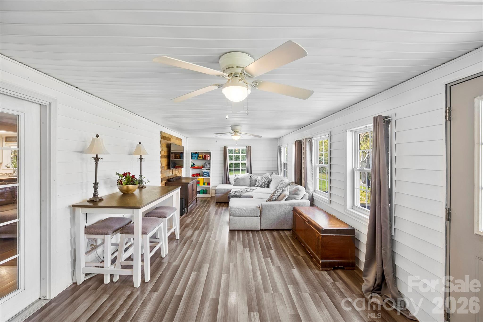 123 Chestnut Ridge Road Kings Mountain, NC 28086 - Photo 25 of 36 a living room with furniture a chandelier fan and a large window