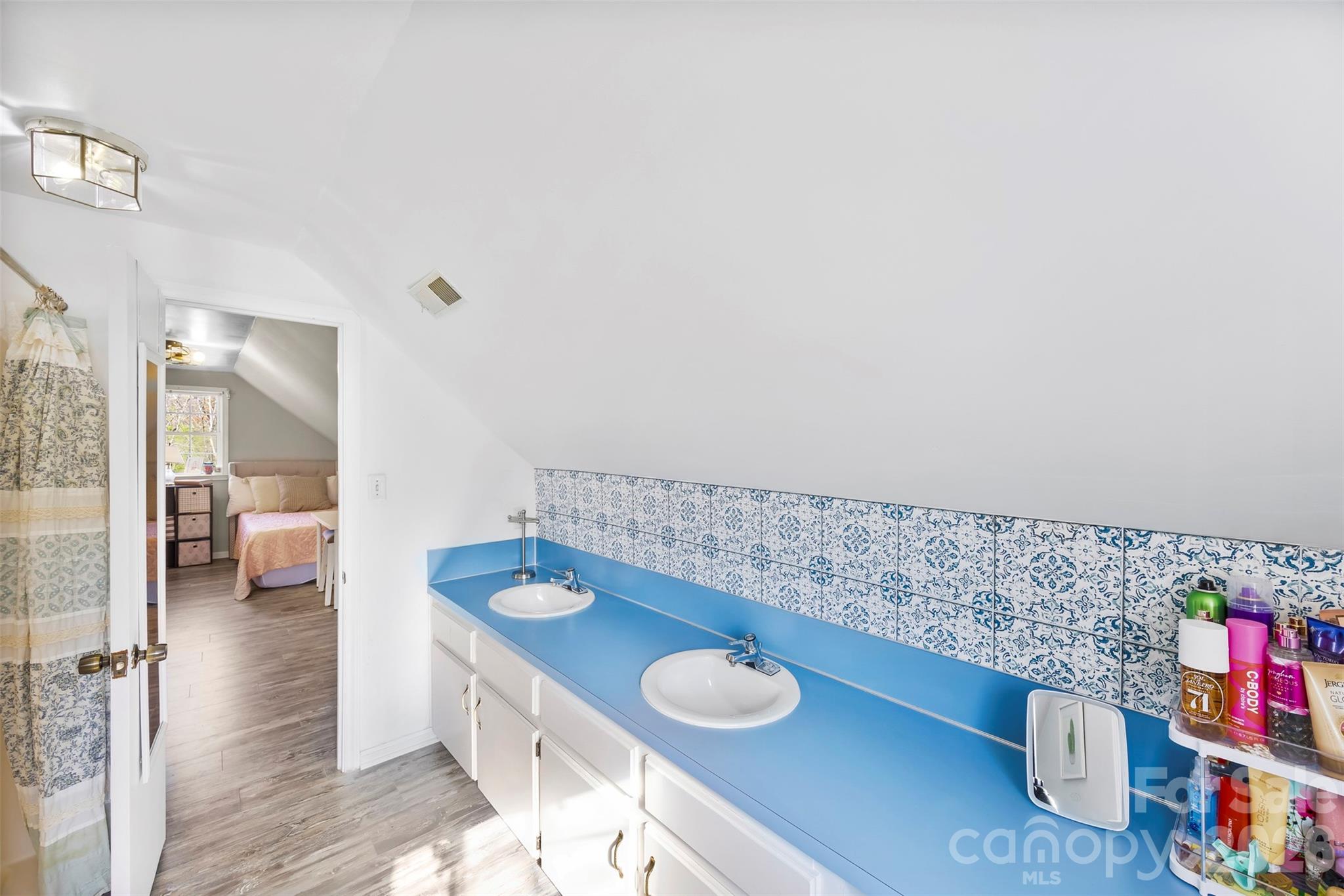 123 Chestnut Ridge Road Kings Mountain, NC 28086 - Photo 30 of 36 a bathroom with a sink mirror and vanity